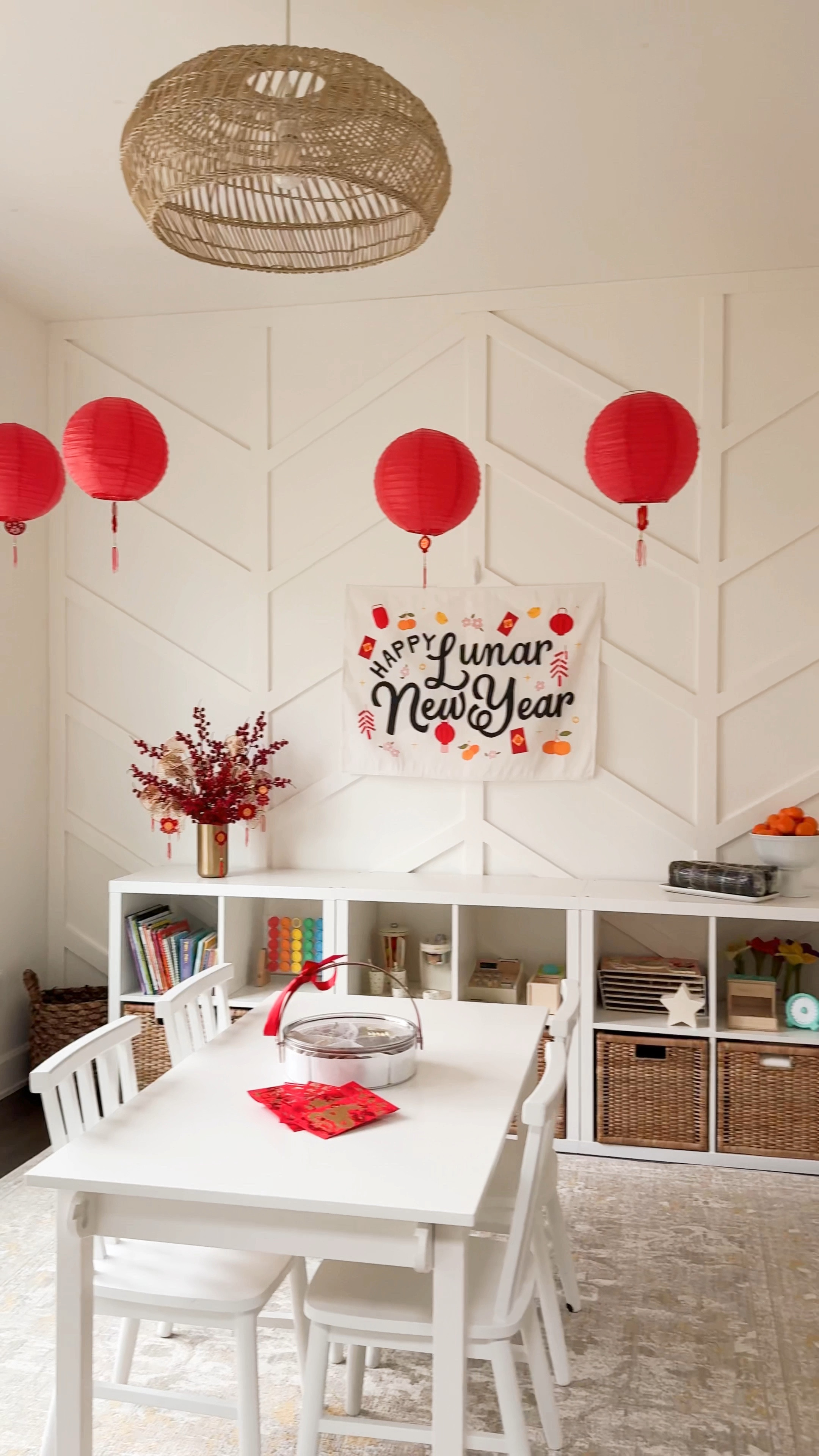 Lunar New Year Playroom Decor with paper red lanterns, hanging pendants, brass vase, Chinese new year decorations, craft table, wooden chairs, rug, Snack tray, chocolates, wafers


#LTKKids #LTKSeasonal #LTKHome