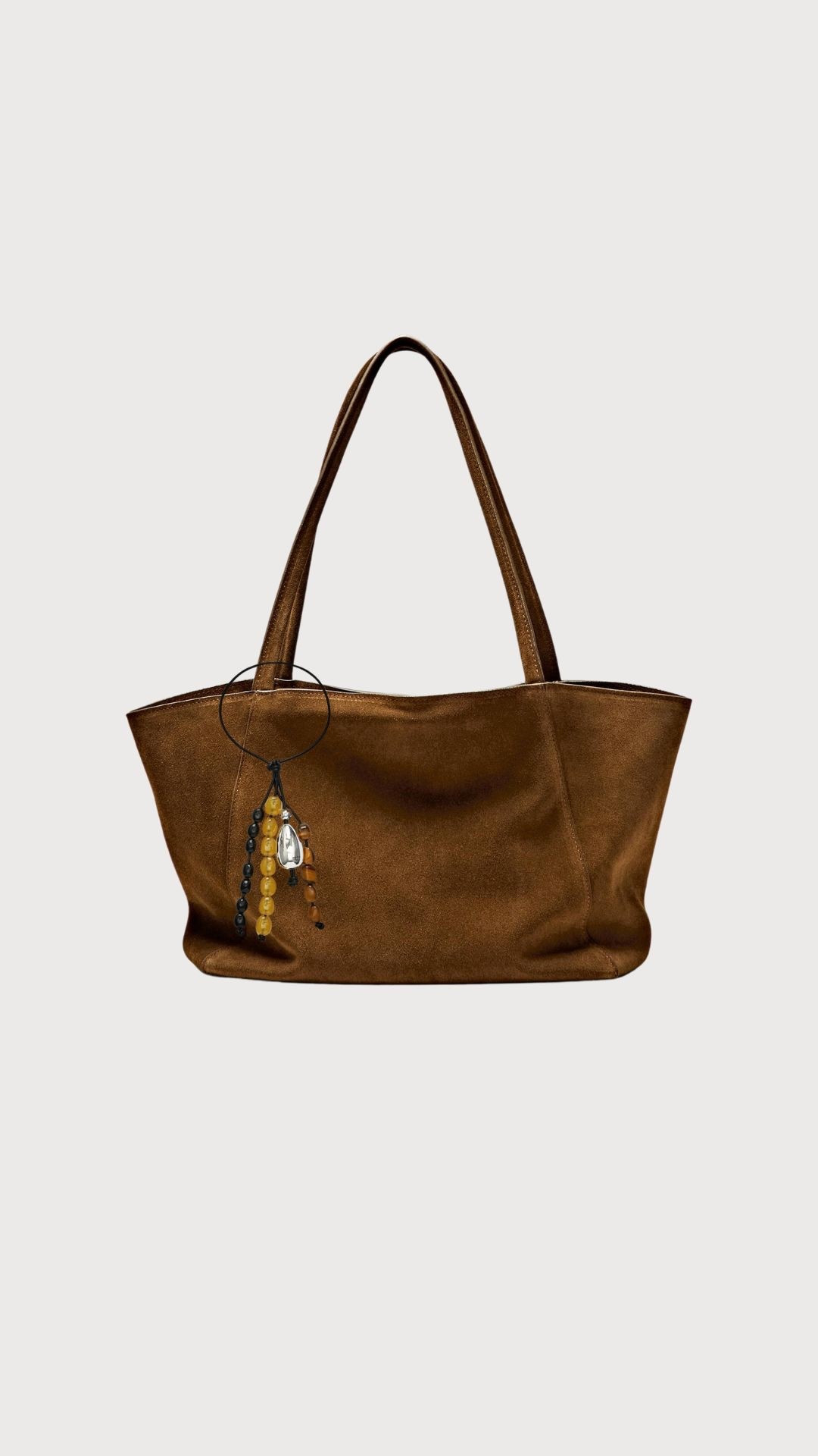 Suede bag 
Bag charm 