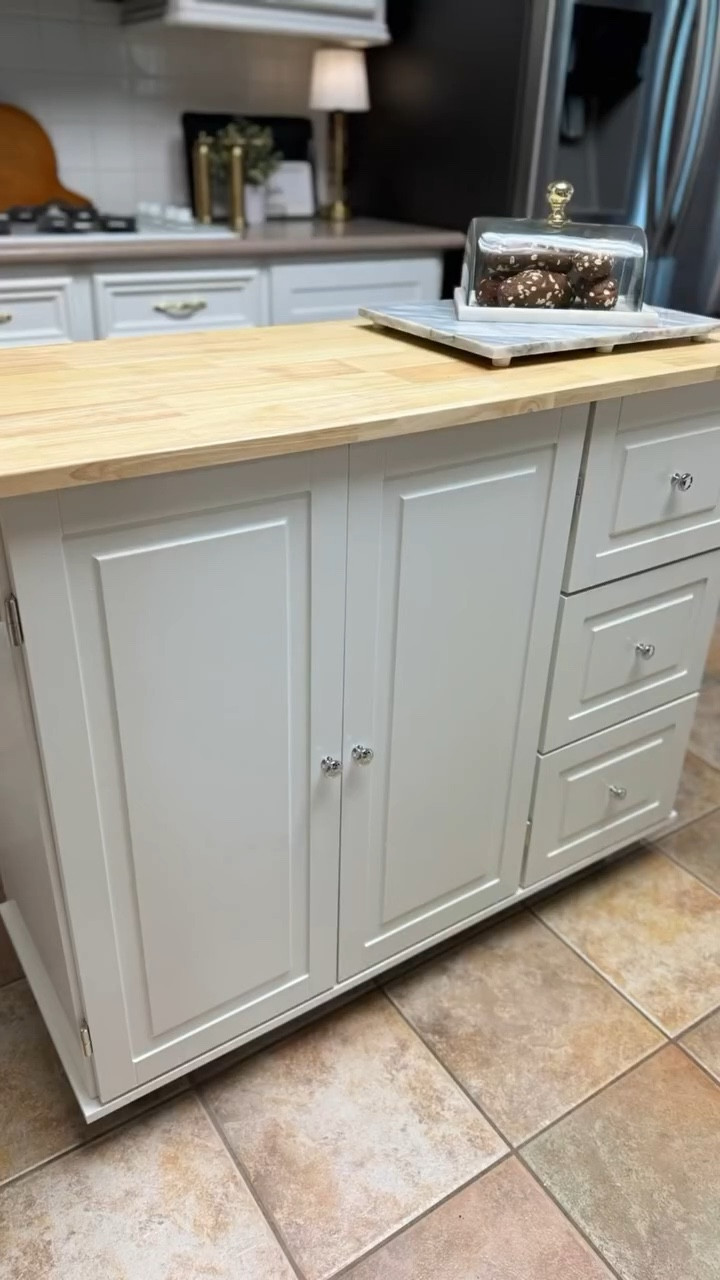 Found the perfect solution for our kitchen storage problem with this rolling kitchen island from @wayfair 

I love that you get both cabinet and drawer space to help hide away miscellaneous items you need to store away. The countertop is solid wood and has an a drop leaf to add extra surface area when needed for buffets or even extra seating. 

I plan to add a few additional details to make it fit the look and feel of my kitchen refresh. It is available in several color combinations. 

Comment ISLAND to receive a direct link to shop. *must be f0ll0wing to receive the link or visit my LTK to shop there. 

#wayfair #wayfairfinds #wayfairhome #kitchen #kitchenstorage #kitchenisland #functionalstorage #storagesolutions