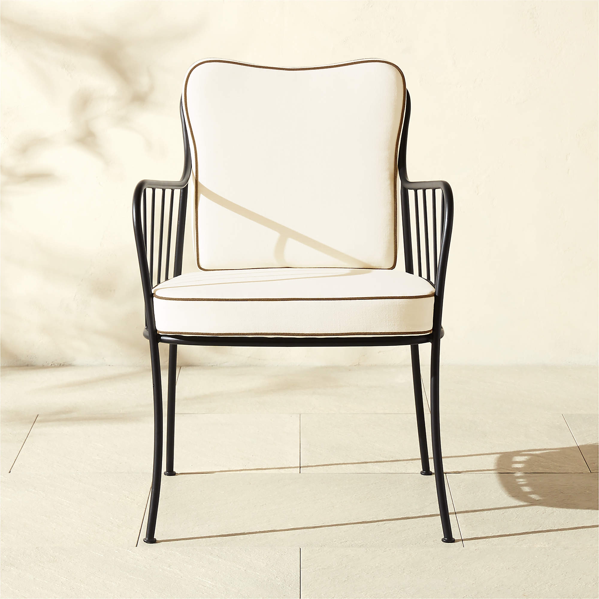 Welling Black Metal Outdoor Dining Armchair with White Cushion + Reviews | CB2 | CB2