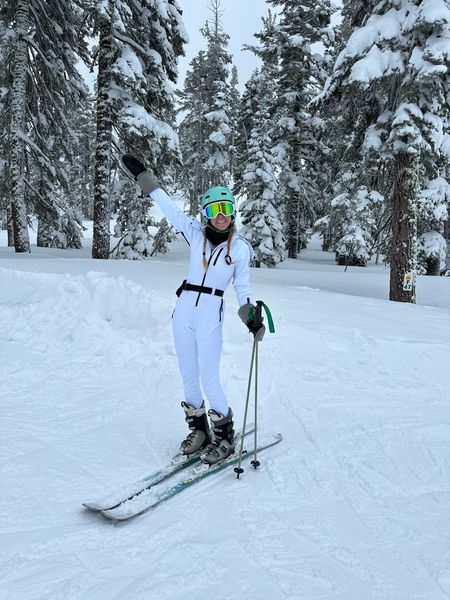 White ASOS ski snow suit onesie with fur hood for Tahoe weekend with turquoise blue googles and helmet for a winter outfit. Ski suit also comes in blue and black!

#LTKfit #LTKSeasonal #LTKtravel