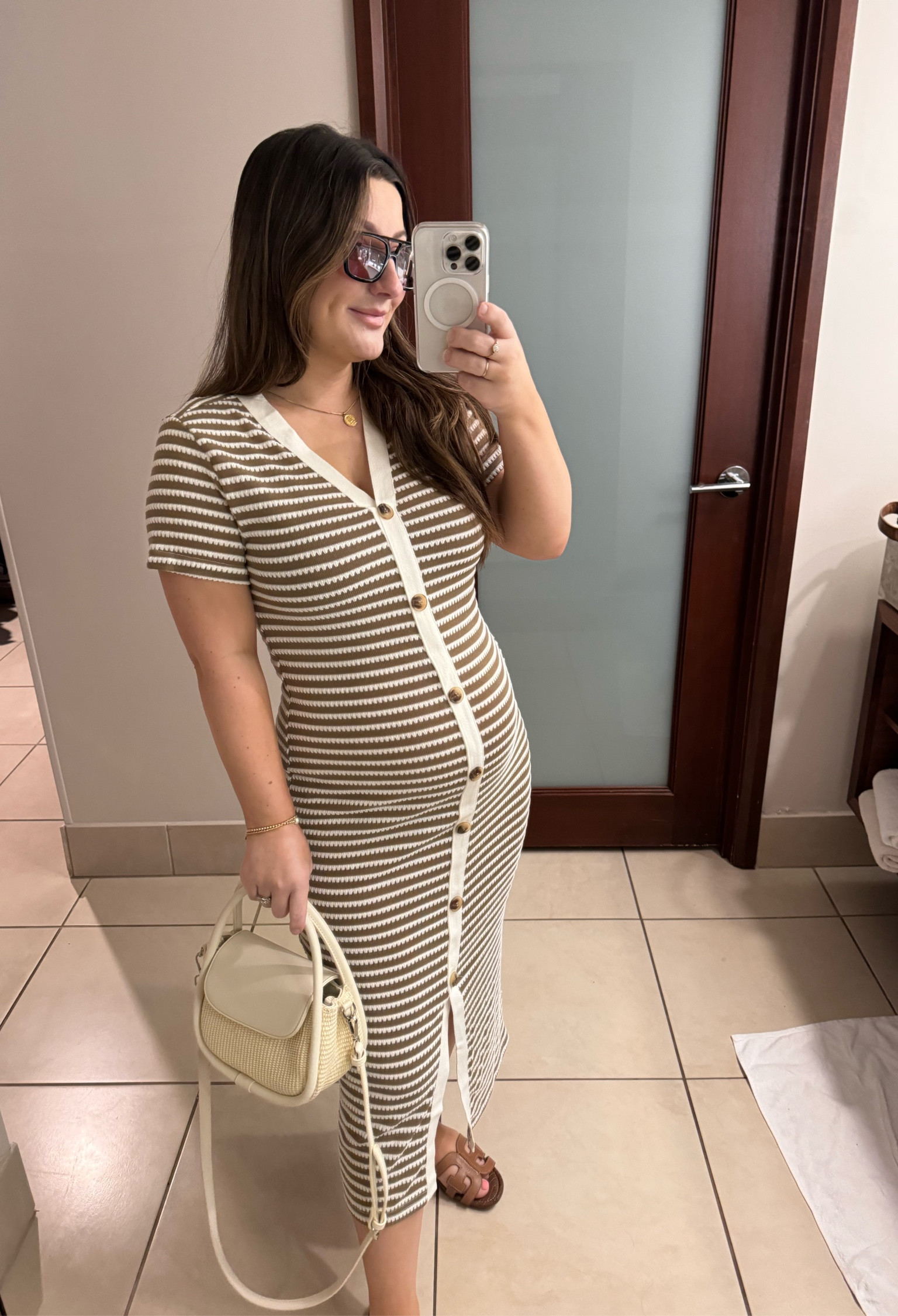 Amazon spring dress
Runs slightly big- it’s stretchy! Size down! I’m in a small! 26 weeks pregnant!

Buttons are not functional- sadly!
Purse also linked!
Sandals run true to size plus they come in wide! Wide sandals!

#LTKstyletip #LTKfindsunder50 #LTKSeasonal