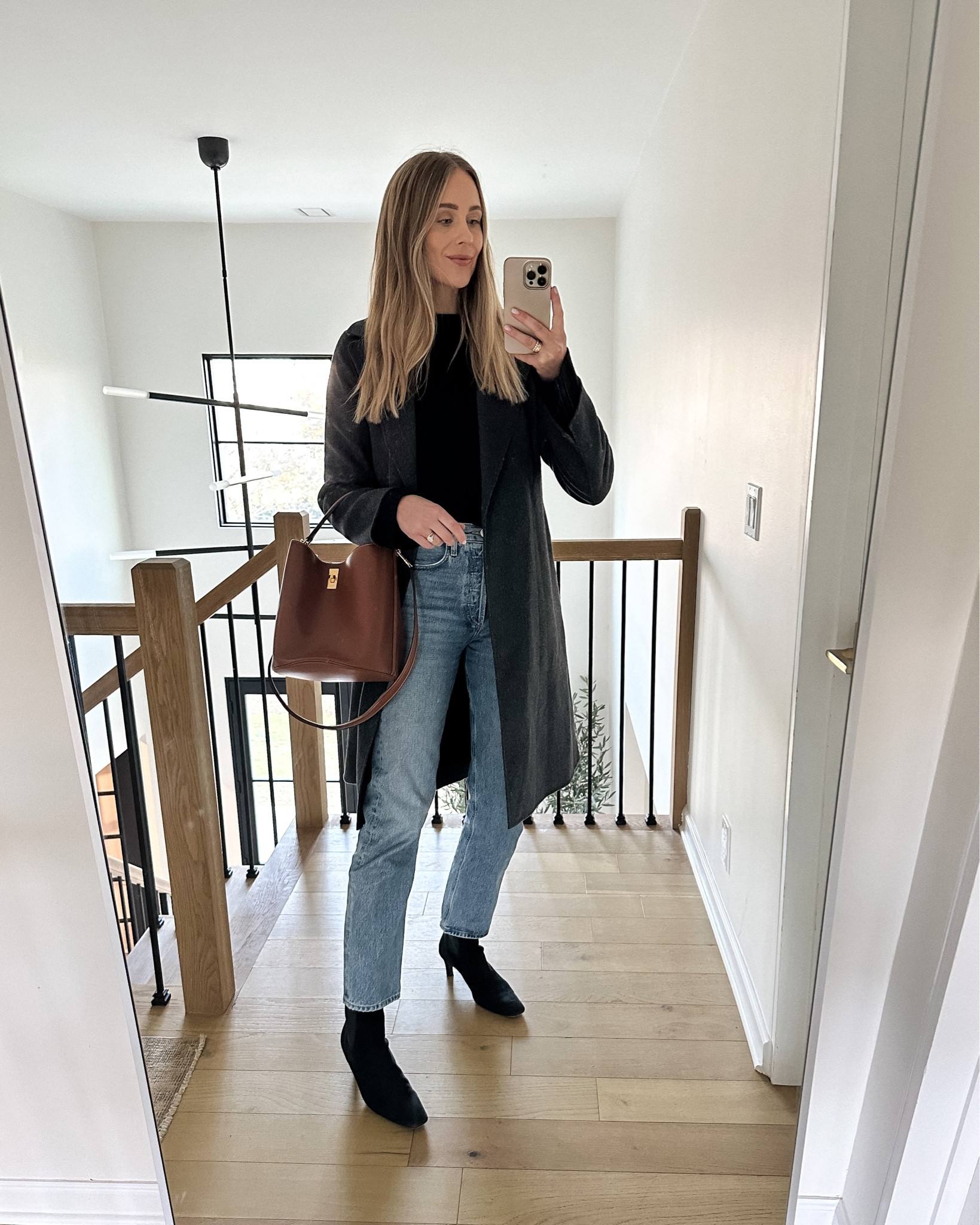 Fashion Jackson wearing charcoal grey wrap coat (mine is max Mara, linked similar) black sweater (small) AGOLDE jeans, black toteme boots, Celine bucket bag #fashionjackson #winteroutfit  

#LTKSeasonal #LTKstyletip #LTKshoecrush