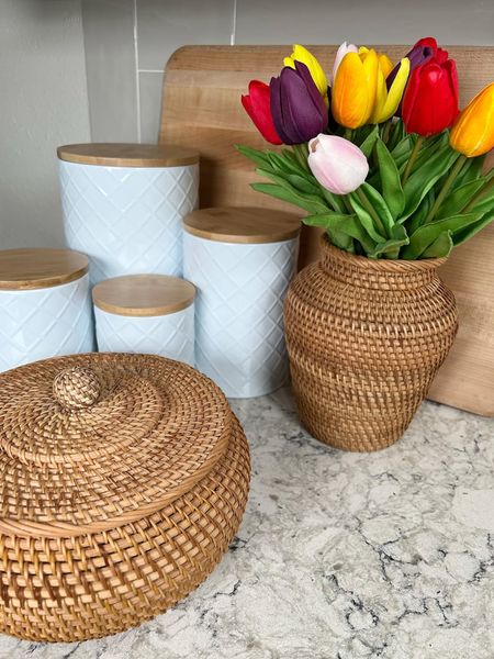 Kitchen canisters look pretty with this rattan vase and rattan storage box with lid. And the tulips! #home #amazon #amazonhome #founditonamazon #kitchen #kitchenorganization #kitchenstorage #storage #tulips #fauxflowers #vase #cuttingboard 

#LTKhome