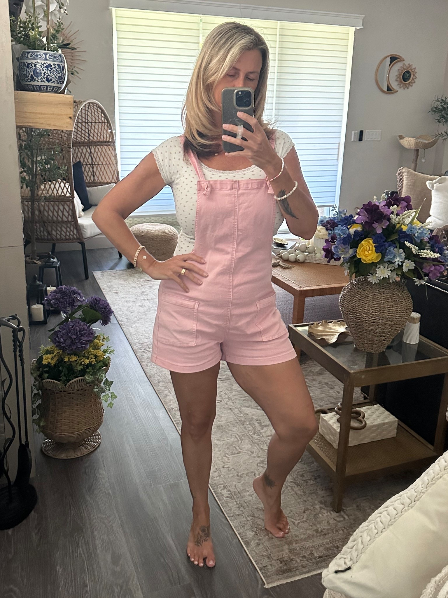 Love these overalls they are super comfy cute and then the pockets are the best paired  with a cute floral print  tee #overalls #pink #summer #fall #wiw #ootd #flowertee #funfashion 

#LTKStyleTip #LTKOver40 #LTKFindsUnder50