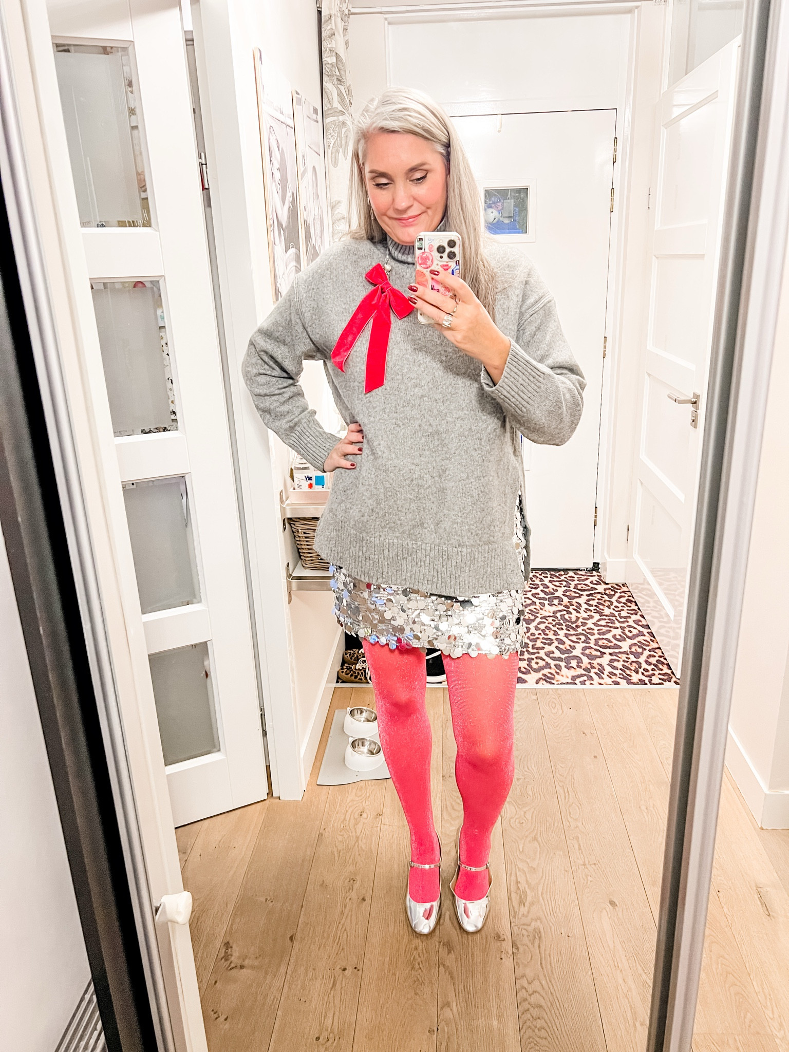Ootd - Tuesday. Christmas Eve. Grey oversized sweater with wool paired with silver sequin mini skirt, pink sparkly tights (Snag), silver Mary Jane shoes (extended sizes available) and a pink velvet bow hair clip attached to a pearl necklace. 



#LTKeurope #LTKnederlands #LTKpartywear