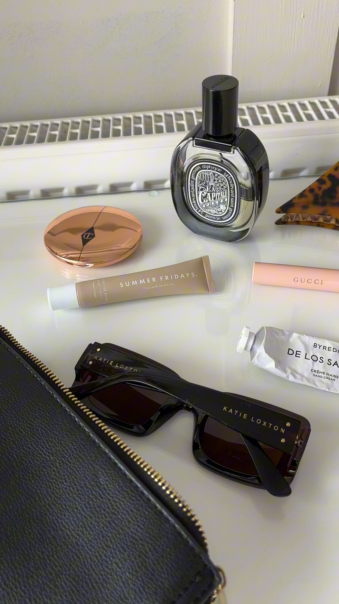 What’s in my day bag summer edt….
I couldn’t live without these essentials to be quite honest in a busy mum life they make me feel me!!!

The scent by @diptique is beautiful and refreshing it makes me feel I’m in Paris.

The shades are beautiful and so wearable by @katieloxton

My @gucci mascara is smudge proof and waterproof it builds a subtle lash and lasts all day

The @charlottetilbury powder keeps my face fresh and comes in such cute packaging

@summerfridays lip balm is like heaven on my always so dry lips smells on vanilla so a winner!!

The classic claw clip for when I need to be in mum mode

@byredo for the most gorgeous scented hand cream again on the pricey side but with my hands changing nappies and cleaning and working I totally need as much luxury as I can get on them. 

That’s it hope you love 

#LTKstyletip #LTKbeauty #LTKitbag