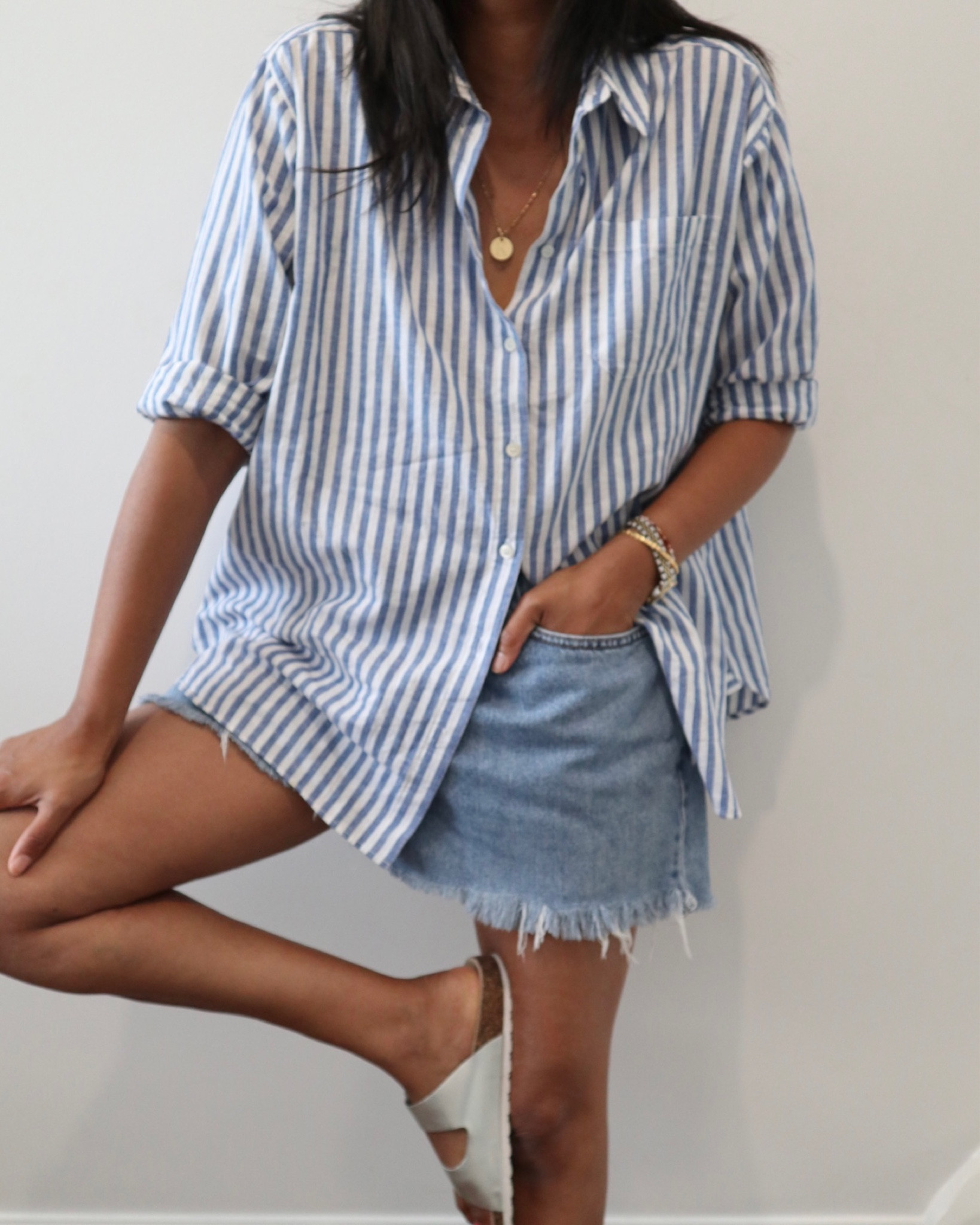 Oversized shirt, striped shirt, oversized stripe shirt, blue denim shorts, denim shorts, vintage denim shorts, silver sandals, strappy sandals, holiday outfit, neutral outfit, summer outfit, Sezane, Levi’s, boden, & other stories, Birkenstock 

#LTKstyletip #LTKeurope #LTKSeasonal