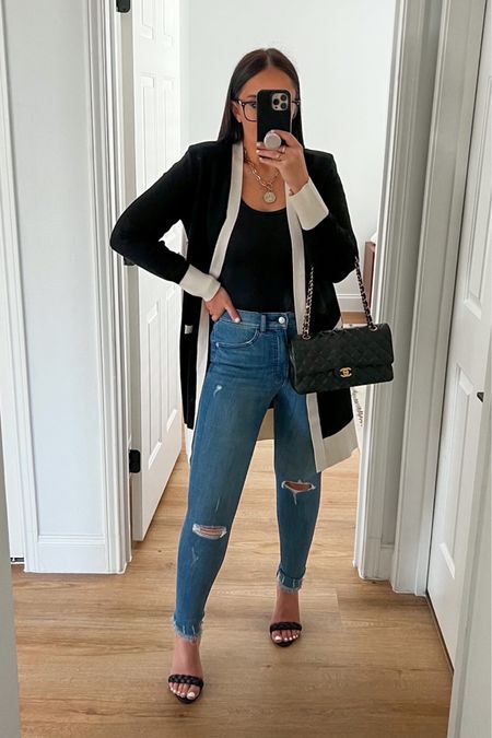 Amazon Essentials black tank top wearing size medium. High Waisted Medium Wash Ripped Raw Hem Skinny Jeans wearing size 4. Tipped Padded Shoulder Novelty Button Pocket Cardigan waring size small. 

Follow my shop @thehouseofsequins on the @shop.LTK app to shop this post and get my exclusive app-only content!

#liketkit 
@shop.ltk
https://liketk.it/3ZDDW