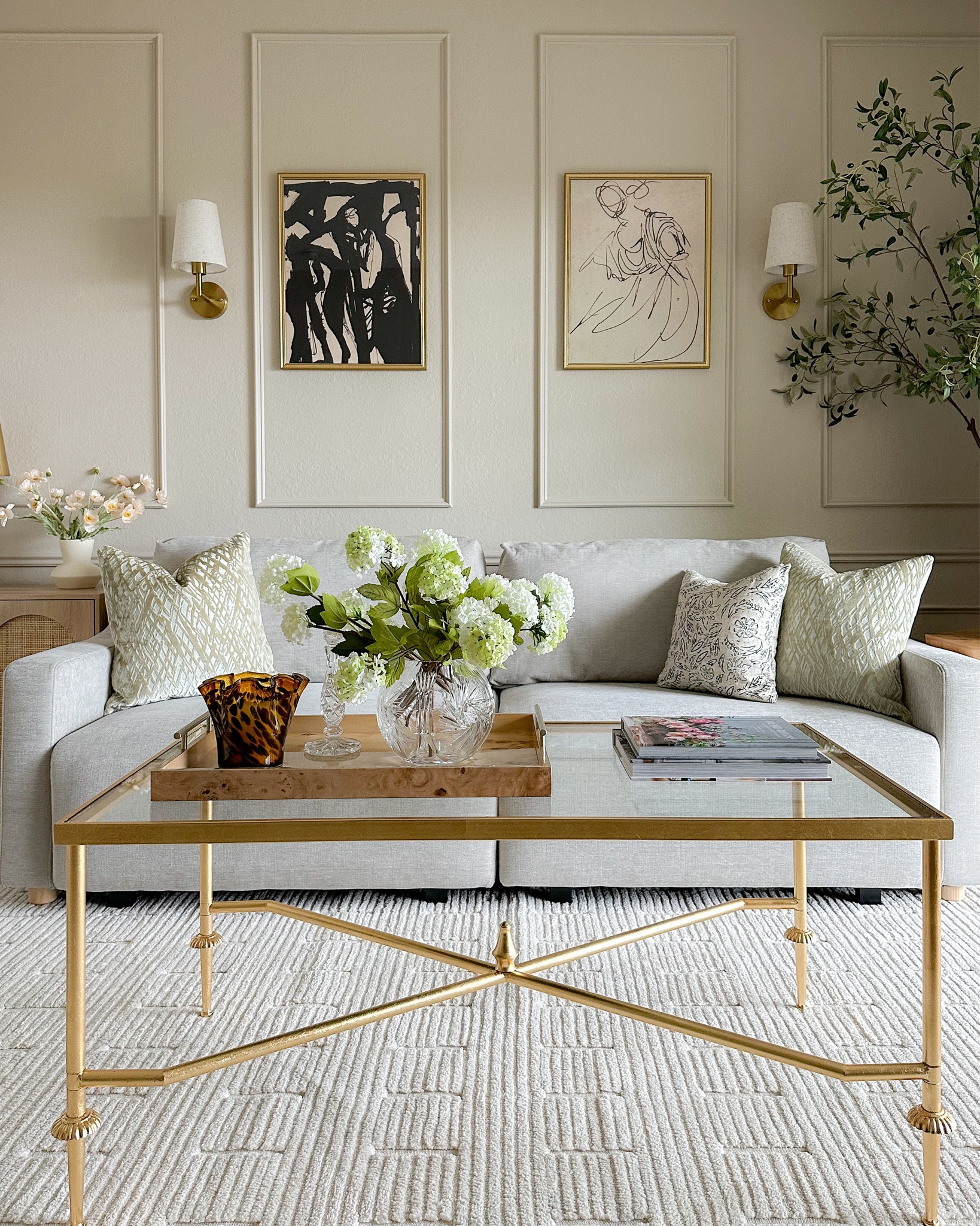 Lounge room decor featuring my Amazon sofa, coffee table, wireless sconces, printable artwork, pillow covers, and coffee table decor!

#LTKfindsunder50 #LTKsalealert #LTKhome