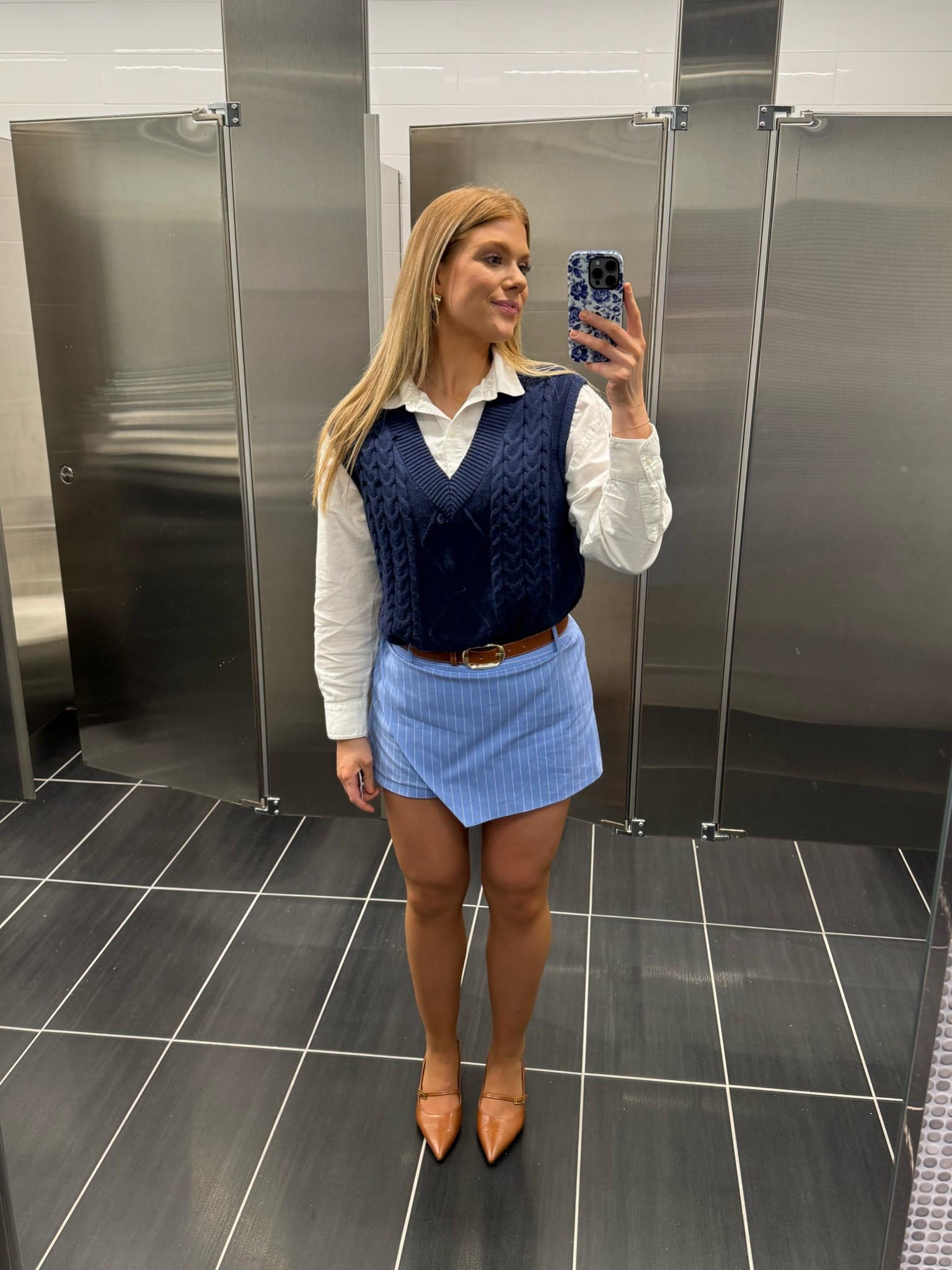 Blue skort paired with a navy sweater vest and white button up! My favorite brown sling back shoes!

#LTKstyletip #LTKshoecrush #LTKworkwear