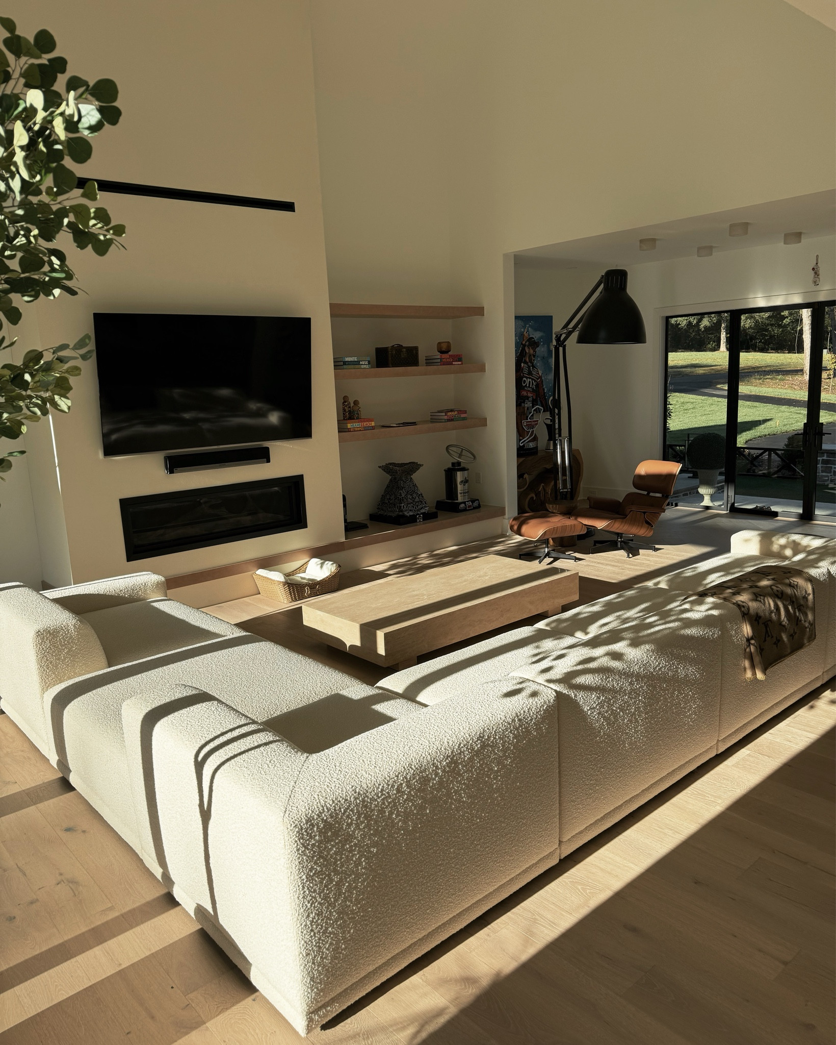 Living room goals 🤍 The sofa is a custom block cream material, the Eames lounge chair (Design Within Reach) is camel leather with walnut wood, and our gorgeous new Travertine coffee table is also from CB2 😻 #mycb2

#LTKStyleTip #LTKHome