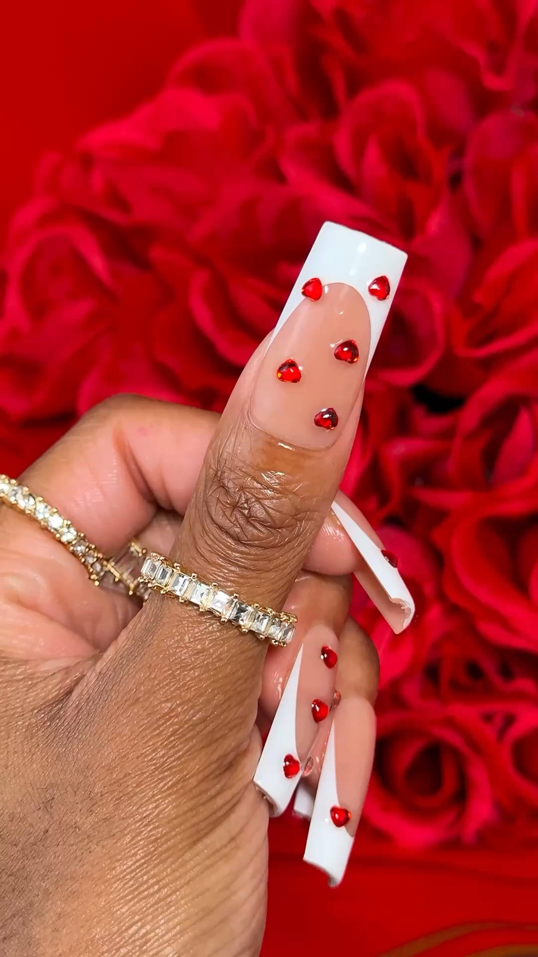 Girl cancel that nail appointment and let me show you how to do these easy Valentine’s Day nails at home 💅🏾❤️✨.

I use extra long French tip nails with a brown base, from BTArtBox to do this set. The red heart rhinestones make these nails look so festive!

#LTKValentine #LTKBeauty