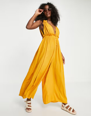 ASOS DESIGN crinkle rayon double strap plunge smock jumpsuit in mustard | ASOS (Global)