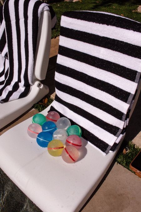 Summer backyard fun! Pool side foldable chairs with cabana striped towels and reusable water balloons 

#LTKswim #LTKkids #LTKSeasonal