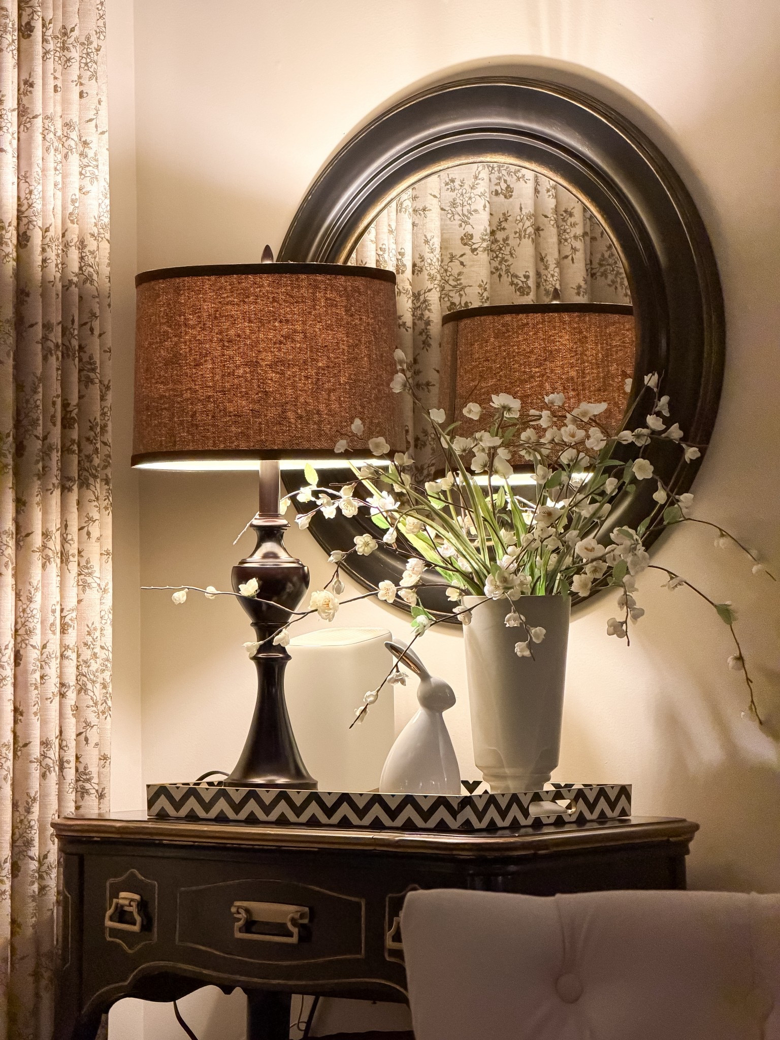 A quiet little corner glowing into the night 🌙✨ floral curtains, cozy table lamp glow, early Spring blooms, and a cute bunny keeping watch. my favorite way to end the day! 

#LTKSaleAlert #LTKHome #LTKselfcare