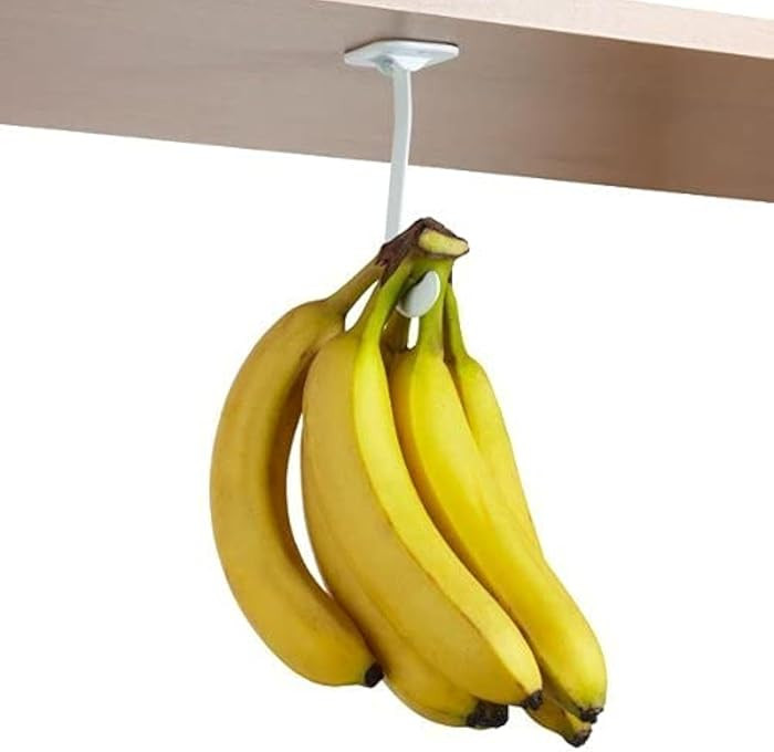 Banana Hook Hanger Under Cabinet Hook Ripens Bananas with Less Bruises, Folds Up Out of Sight Whe... | Amazon (US)