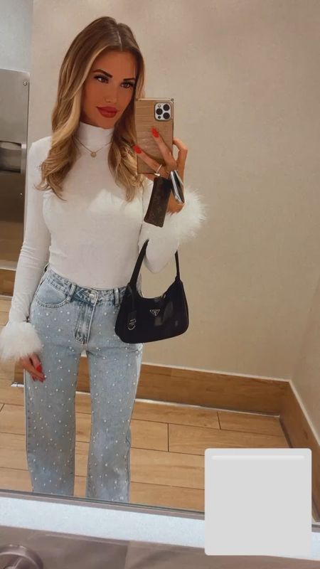 Winter outfit 
White crew neck 
Fur sleeves 
Denim pearl jeans 
Prada re-edition bag 
Holiday outfit 
Winter white 
White booties 
New Year’s Eve 
Boots
Jeans 
Holiday party 
Purse 
Ski outfit 

#LTKSeasonal #LTKsalealert #LTKfindsunder100