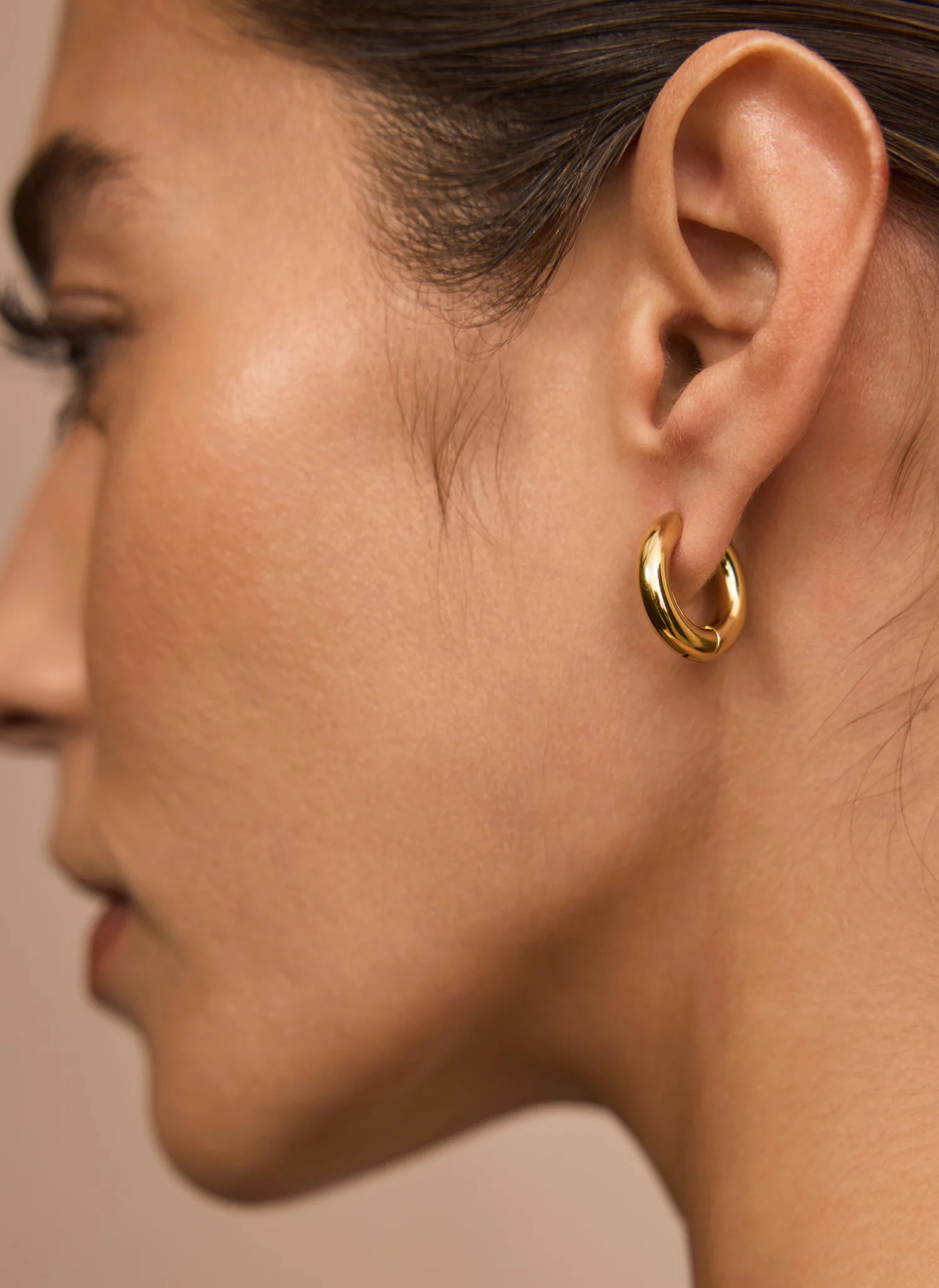 Gold Stainless Steel Mini Hoop Earrings | Mint Velvet