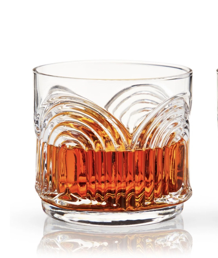 A repeating rainbow motif pressed into lead-free crystal gives these textured tumblers Art Deco decadence. Perfect for a generous Double Old Fashioned or Negroni on the rocks, this stackable barware saves space on your bar cart and adds some Gilded Age style to your glassware collection.

#LTKhome #LTKparties