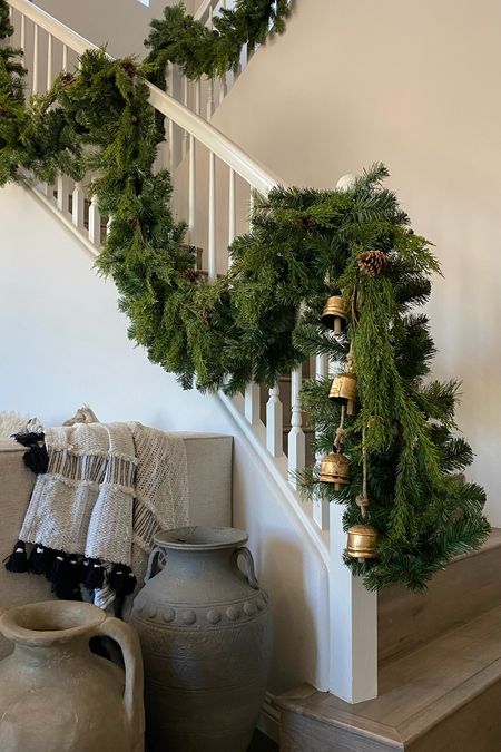 Sharing on IG reels how to create this lush and gorgeous holiday garland look by layering a realistic garland on top of a thicker base garland! 🎄 

Realistic garland. Christmas decor. Neutral Christmas. Hanging bells. Gold bells. Greenery. Cedar garland. 

#Walmart #Amazon

#LTKhome #LTKstyletip #LTKHoliday