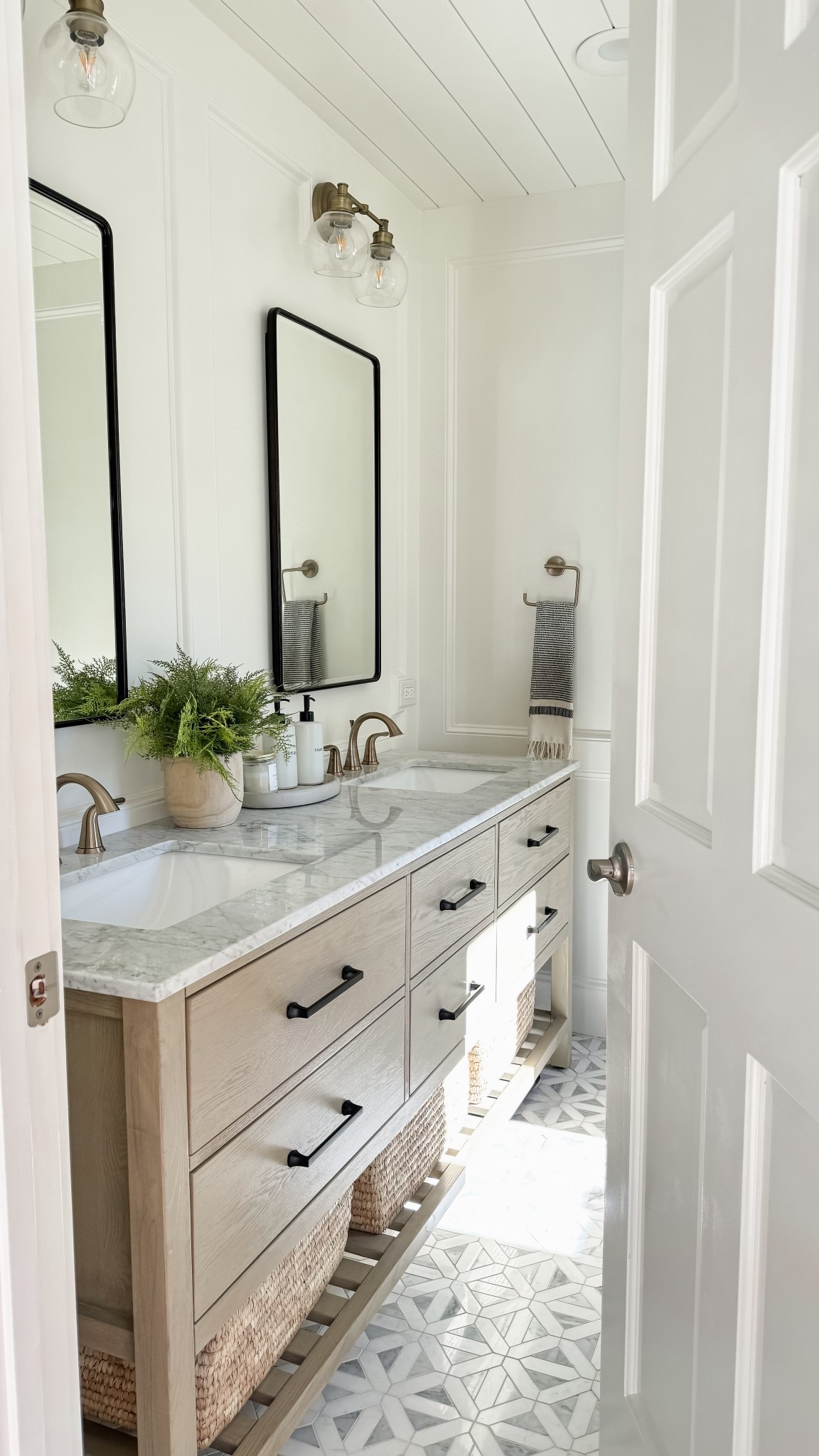 Bathroom design. Neutral bathroom decor. Bathroom makeover. Double vanity. Recessed medicine cabinet. Bathroom mirror. Vanity light. Towel holder. Turkish towel. Drawer pull. Cabinet hardware. Bathroom faucet. Soap and lotion dispenser. Marble tile. Concrete tray.

#LTKHome