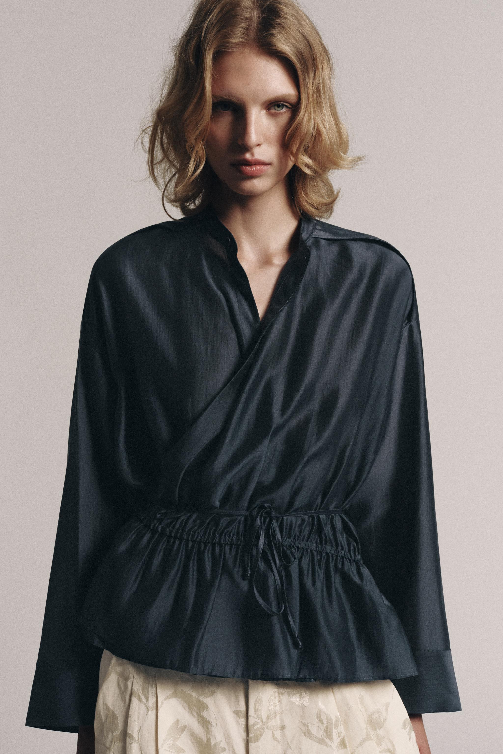 ZARA WOMAN COLLECTIONBlouse made of a lyocell blend yarn. Round neck and short sleeves with cuffs... | Zara US
