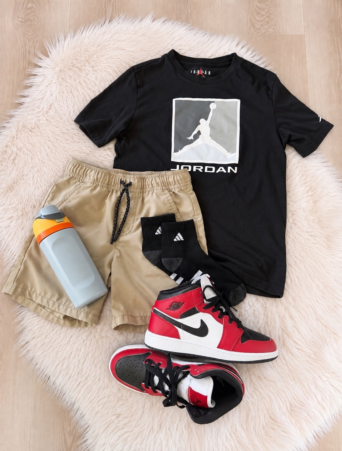 Easy boys outfit idea for school, weekends + everyday wear! 🖤❤️ My son is all about Jordan right now, and this sporty combo is such an easy win — a Jordan graphic tee, khaki pull-on shorts, Adidas crew socks + red, black and white Jordan sneakers. I love that it’s comfortable enough for school and running around but still looks put together. If you’re looking for boys school outfit ideas, boys fall outfits, Jordan outfit ideas, boys sneaker outfits or casual everyday boys style, I linked everything from this look! @Nike US 

Tween boy outfit | trending boy outfit | easy boy school outfit | boys athletic shoe | boys wicking short

#LTKmomlife #LTKSaleAlert #LTKKids