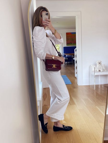 Monochromatic white is never boring. Statement sleeve top, best white jeans around, classic loafers and a pop of red in the handbag

#LTKstyletip #LTKfindsunder100 #LTKover40