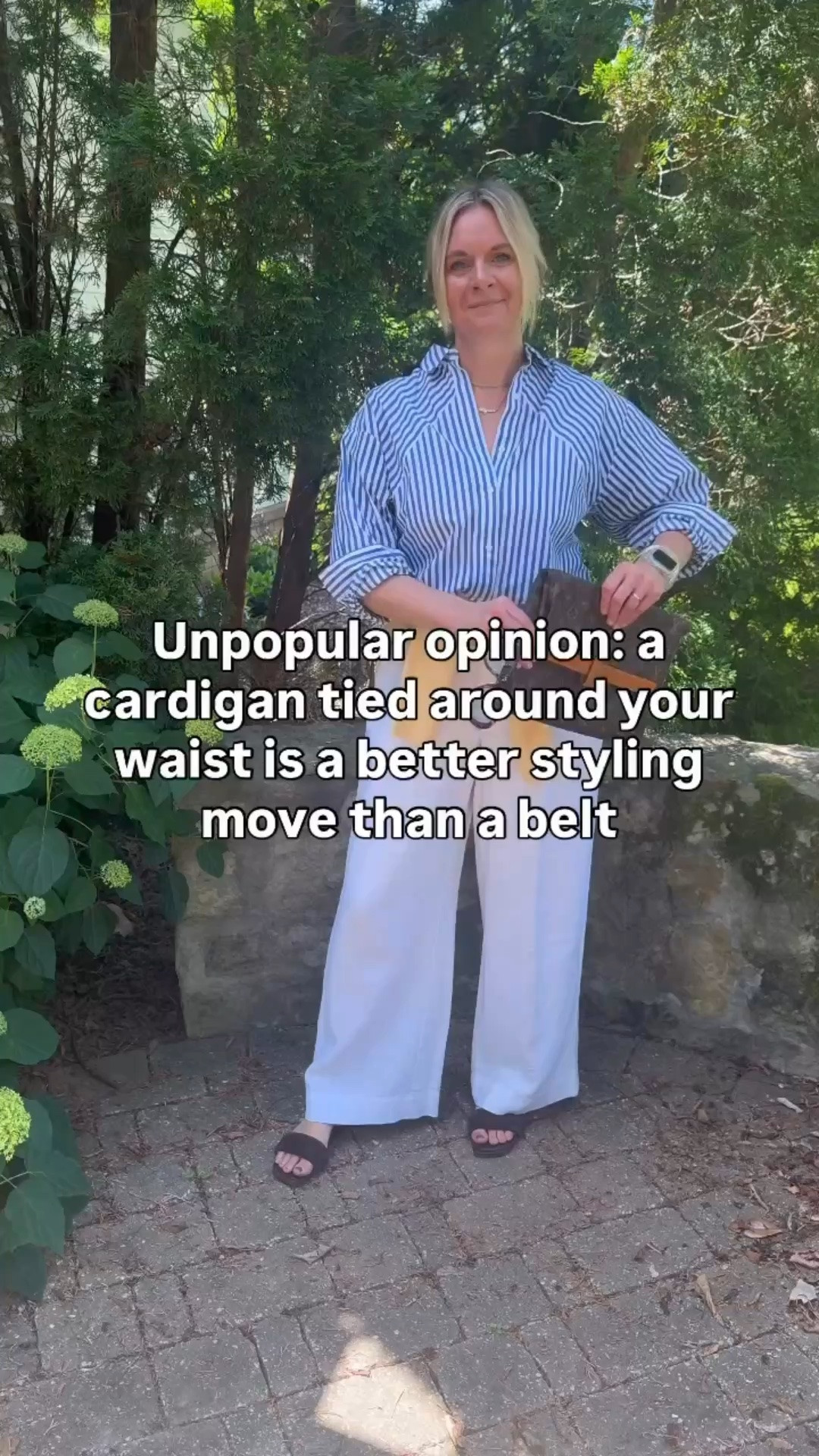 Unpopular opinion: a cardigan tied around your waist is a better styling move than a belt 👇

Here’s why:

💛 It adds color without adding a separate accessory. A yellow cardigan tied at the waist does three things at once — it defines your waist, introduces a pop of color, and adds a layer you can actually use if it gets cool. A belt can only do one of those things.

💛 It makes a simple outfit look intentionally styled. Striped shirt + white linen pants is a great combination on its own. Add a tied cardigan and suddenly the whole look feels considered and put together in a way that’s hard to explain but impossible to miss.

💛 It’s the most versatile layering trick in your wardrobe. Any cardigan, any color, any outfit. Tie it loose for a relaxed vibe, knot it tighter for more definition. It works every single time and costs you nothing extra.

OOTD before heading out for a client personal shopping appointment ✨ Blue and white striped shirt + white wide leg linen pants + yellow cardigan tied at the waist + brown suede slide sandals + layered necklaces + blue lens sunglasses. All from my own closet — linked the closest versions I could find. Everything shoppable below! 👇

#LTKdayinmylife #LTKootd #LTKOver40

Comment SHOP below to receive a DM with the link to this post on my LTK ⬇ https://liketk.it/6dZzd