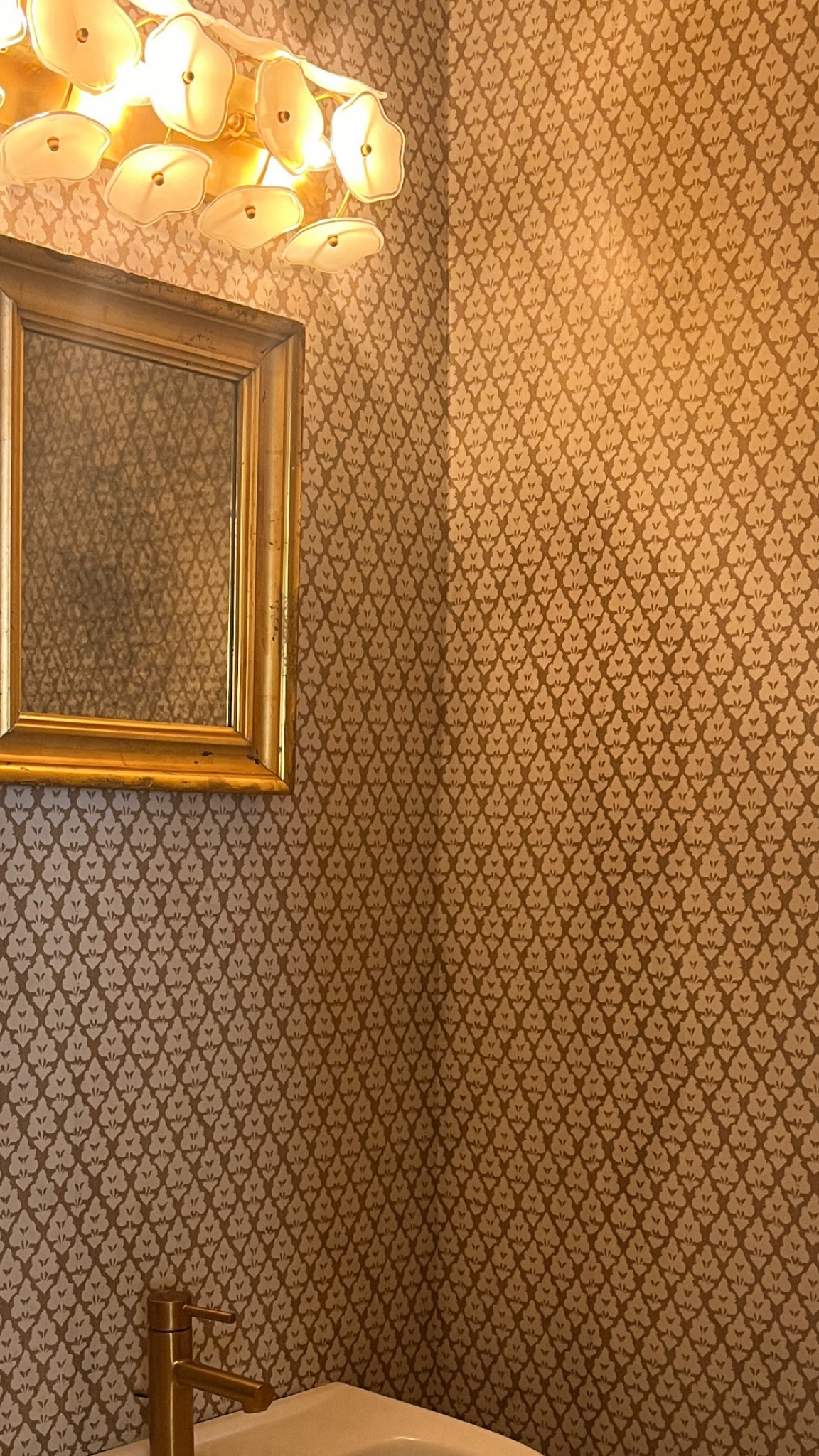 Some powder room updates. Ignore the mirror! Wallpaper is Thibault Arboreta  Linking the light figure. Not pictured but linking the fixtures I bought to match the existing faucet. It’s a darker gold than I would have picked but I didn’t want to change out the existing faucet from the previous owner.  I tried cheaper options and they felt cheap. These are nice quality. 

#LTKhome #LTKstyletip