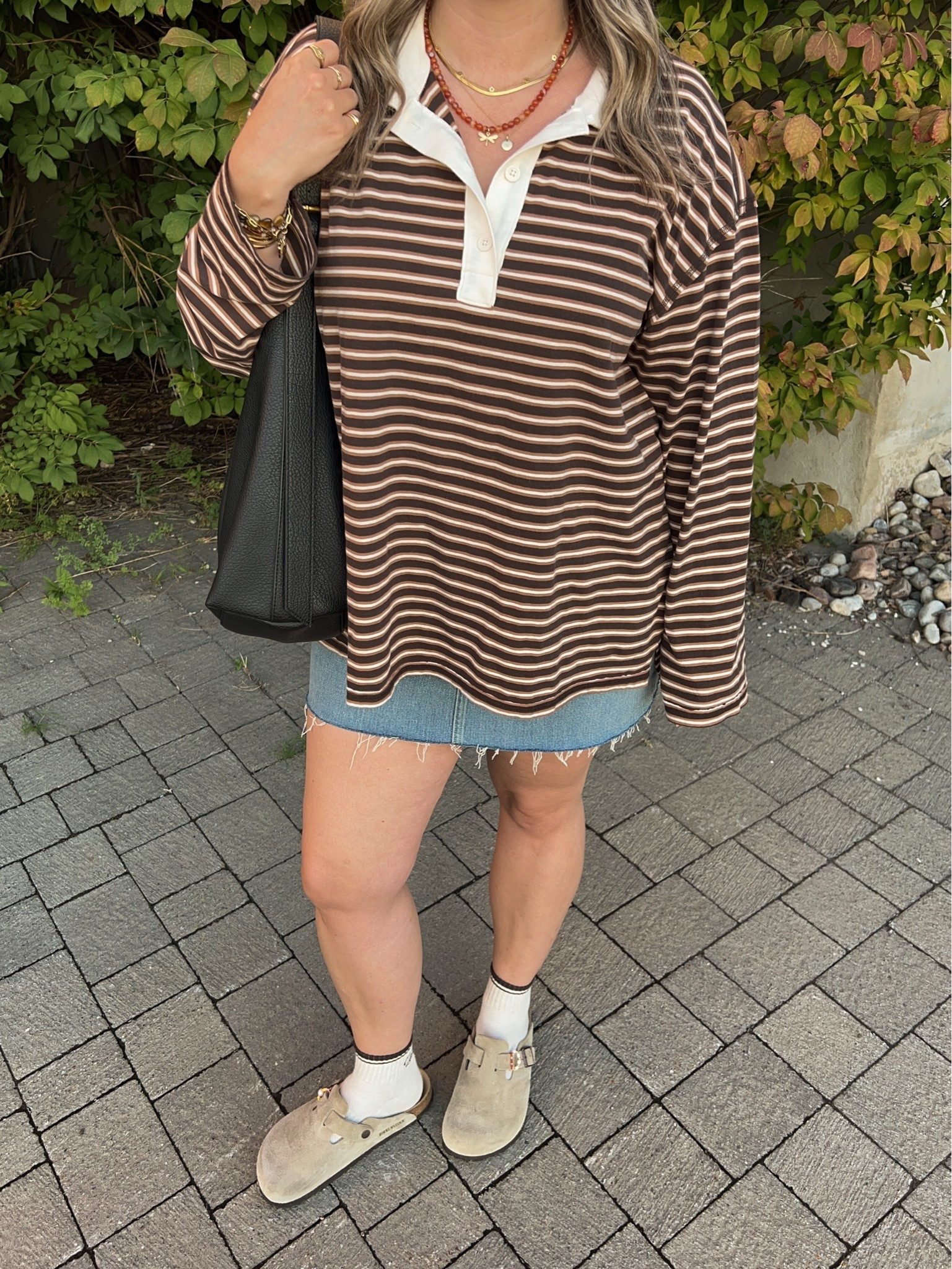 Early fall outfit! Wearing L in the striped rugby polo top, it’s very lightweight so still works for warmer weather! I bought this denim skirt last year in a size 32, would do a 31 if I was purchasing now. I’m a 9.5-10 shoe and wear a 40 in the Birkenstock clogs

#LTKfall #LTKmidsize #LTKstyletip
