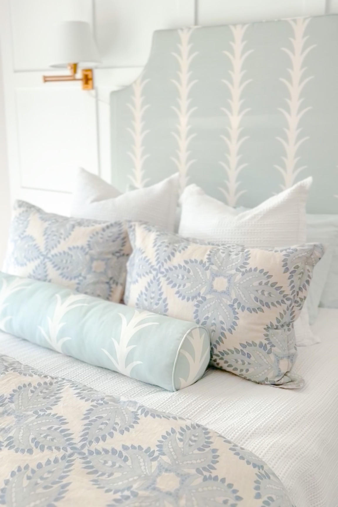 Coastal bedroom, beach house bedroom, blue and white bedding, blue and white duvet, wall lamps, swing arm wall lamp, upholstered headboard, white waffle quilt, honeycomb quilt, bedding, bedroom design, interior design inspo, light and airy bedroom, white bedspread, blue and white fabric, block print pattern

#LTKunder50 #LTKhome #LTKunder100