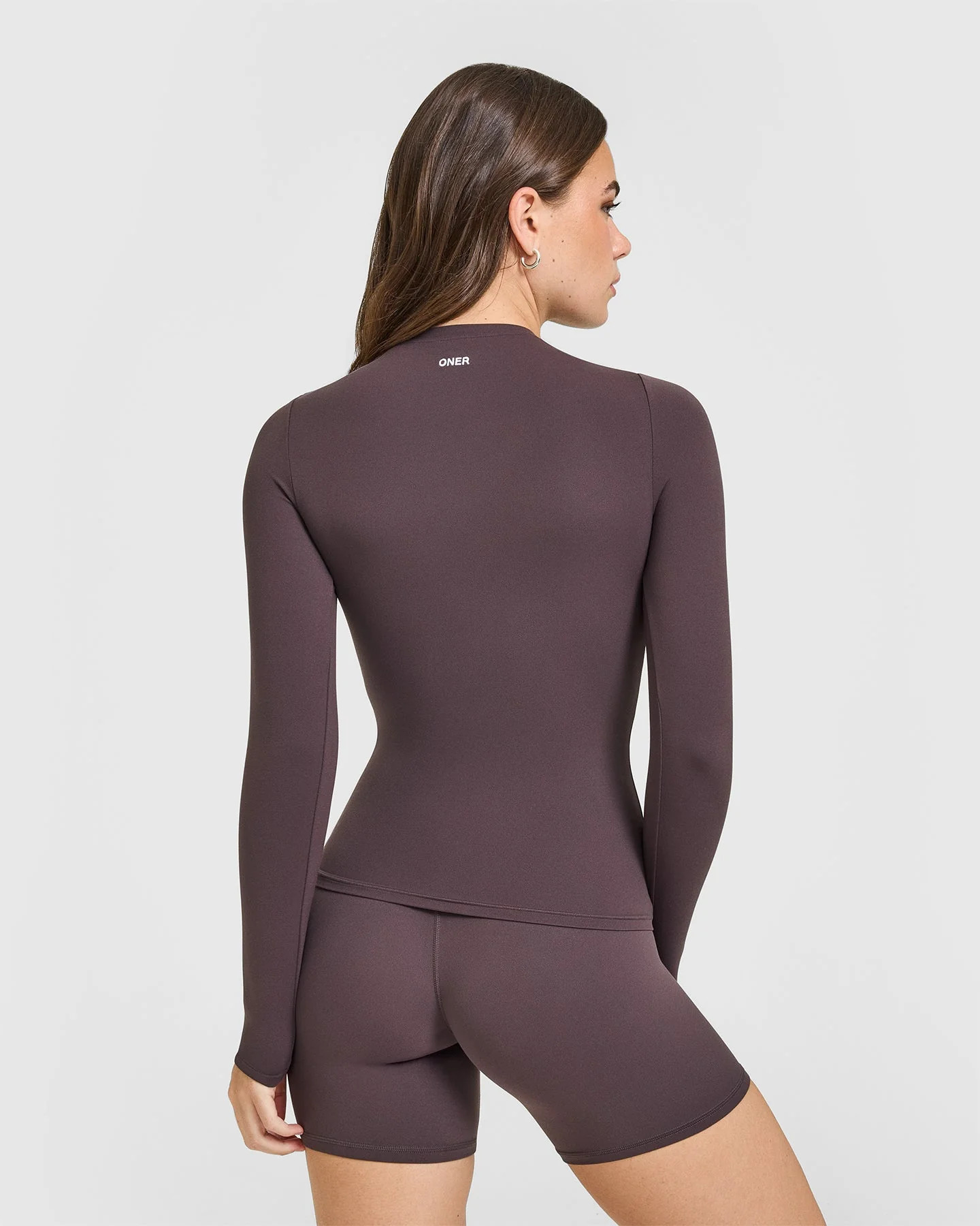 SoftMotion™ Long Sleeve Top with White Logo 
 Dark Umber Brown | Oner Active (UK / US)