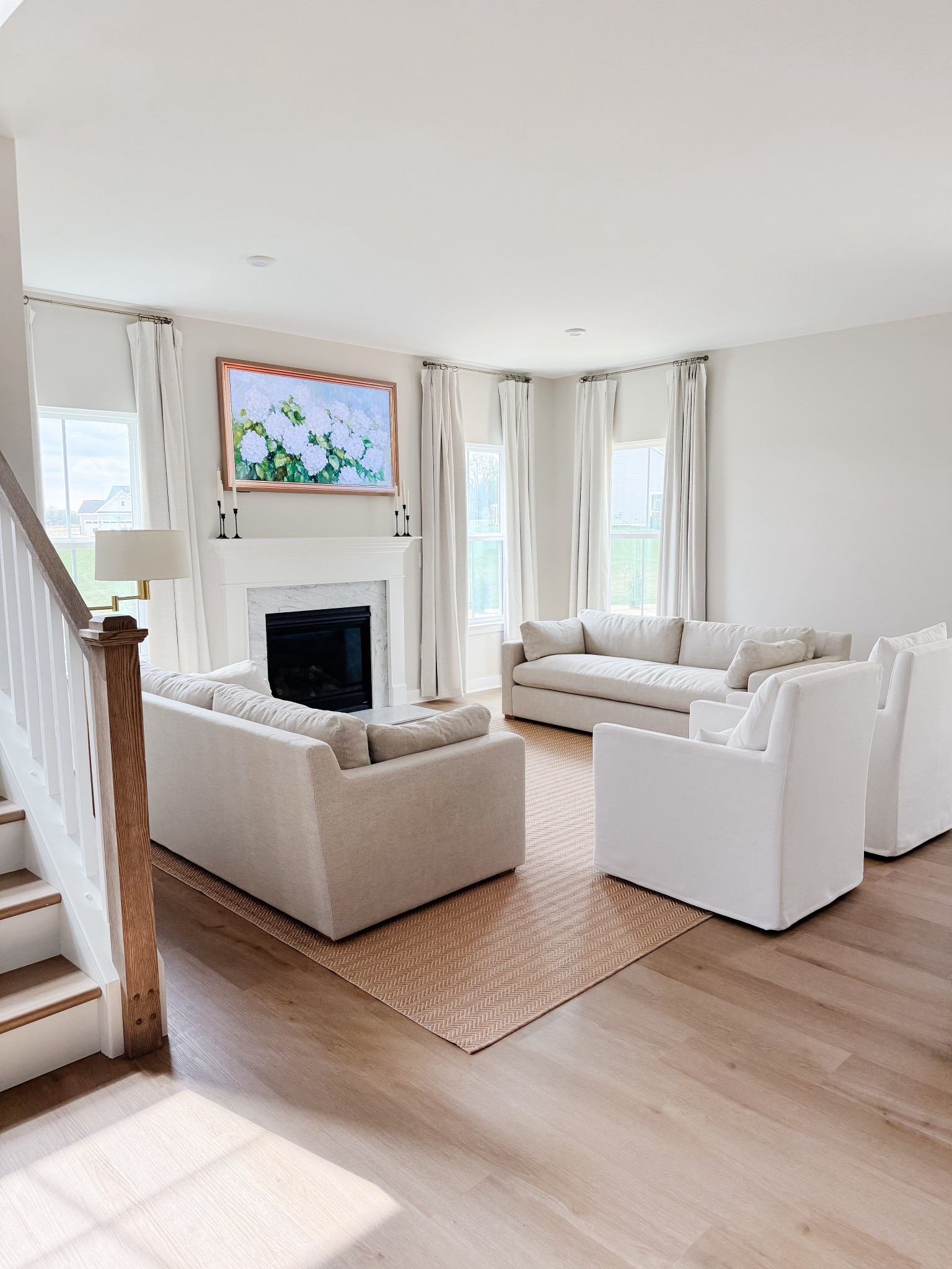 An outdoor rug that also works indoors. I ordered the 10x14 size in natural/cream. It looks like a Ballard Design rug for a portion of the price! Herringbone pattern.

Pinch pleat curtains are blackout and in shade natural. The French return curtain rod is in shade antique bronze. 

#LTKHome