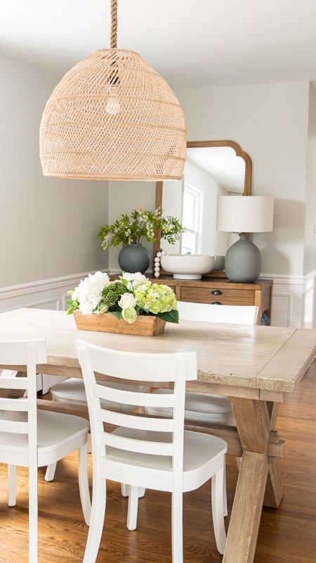 Simple kitchen dining space with natural wood elements, Pottery Barn table, white chairs, shaker chairs, rattan pendant light 

#LTKfamily #LTKhome