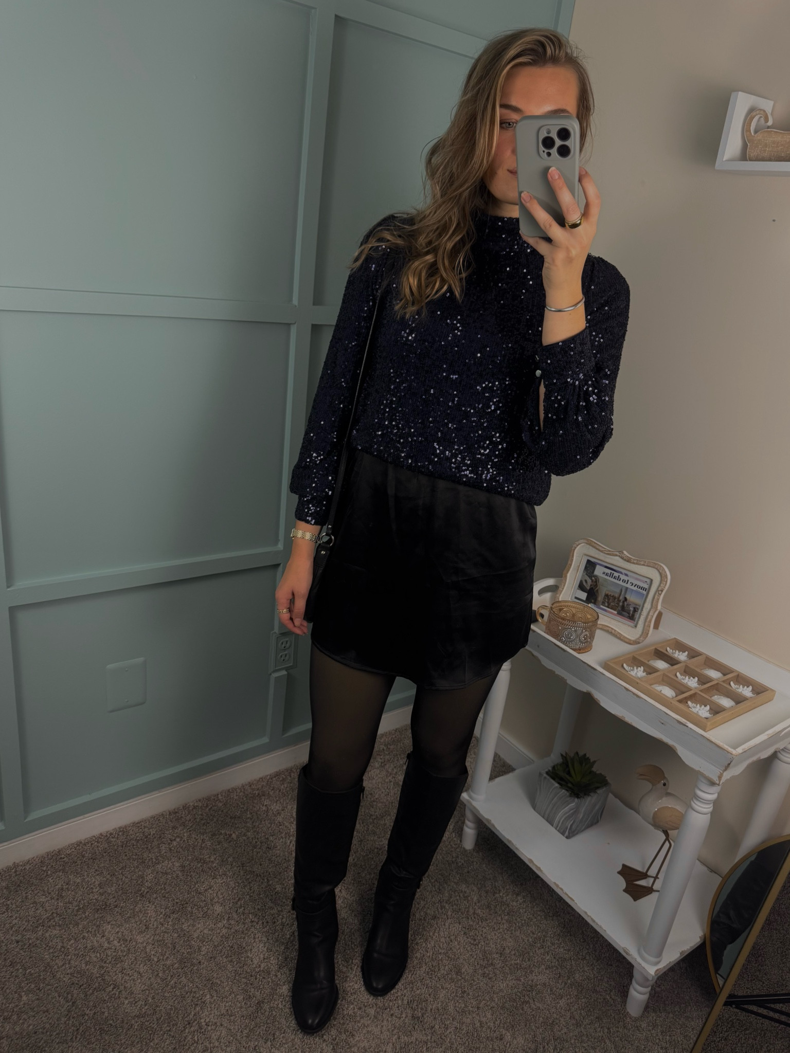 This stunning look features a sparkly navy blue high neck top that adds a touch of glam, paired with a satin mini skort for a sleek and chic vibe. Knee-high leather boots elevate the outfit, making it perfect for a night out or special occasion! #SparklyTop #SatinSkirt #OOTD #NightOutLook #ChicStyle #FashionInspo #LuxuryStyle #KneeHighBoots #GlamOutfit

#LTKBeauty #LTKParties #LTKStyleTip