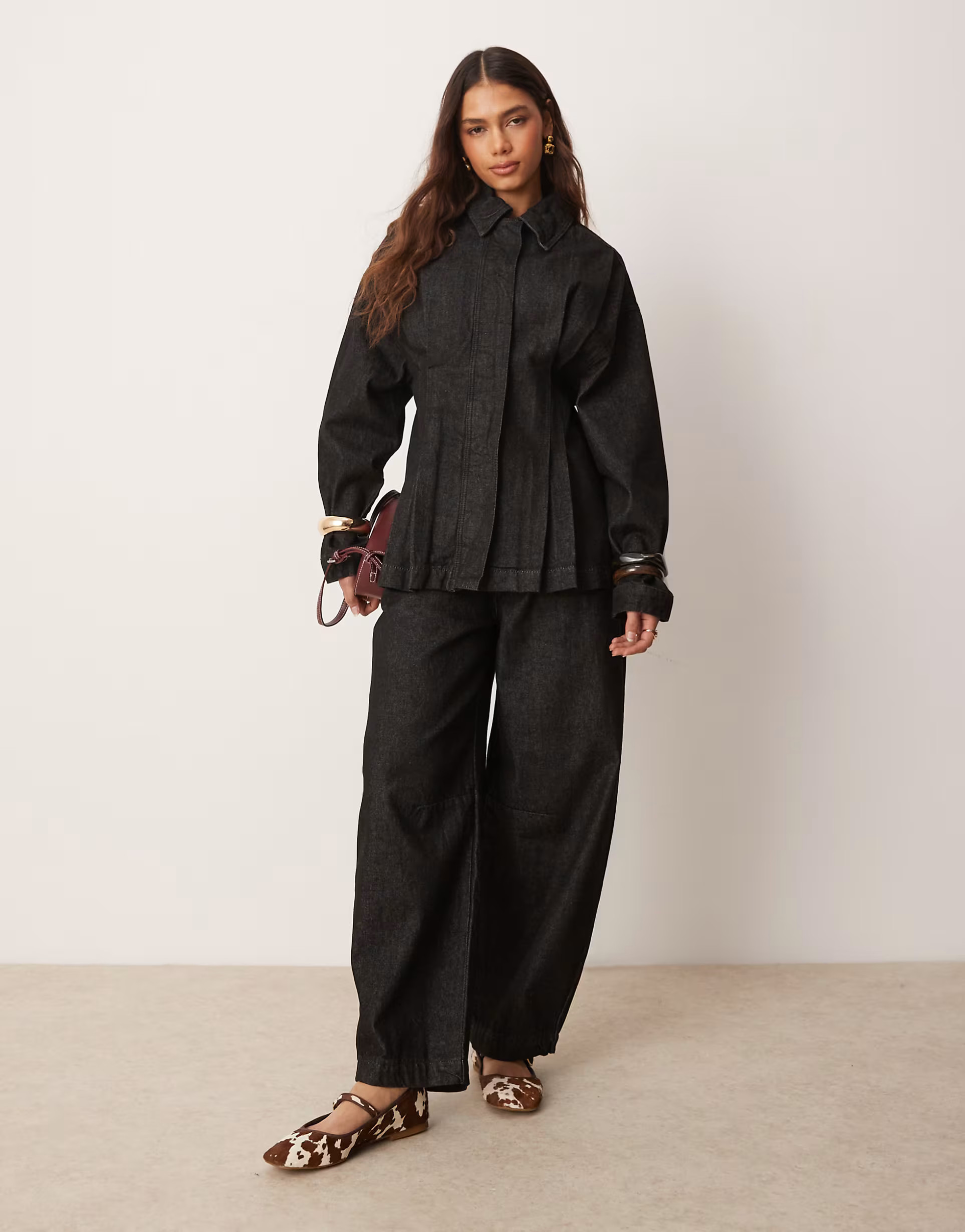 ASOS DESIGN arch leg trousers in black | ASOS (Global)