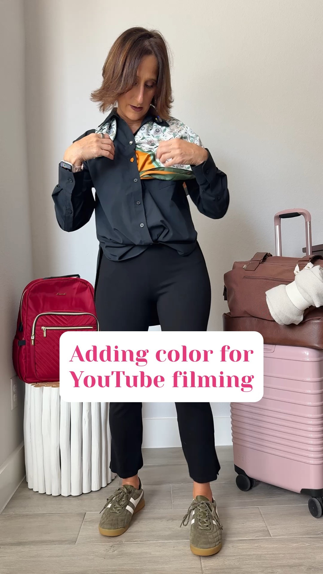 Breaking up the black with a scarf before YouTube travel packing video