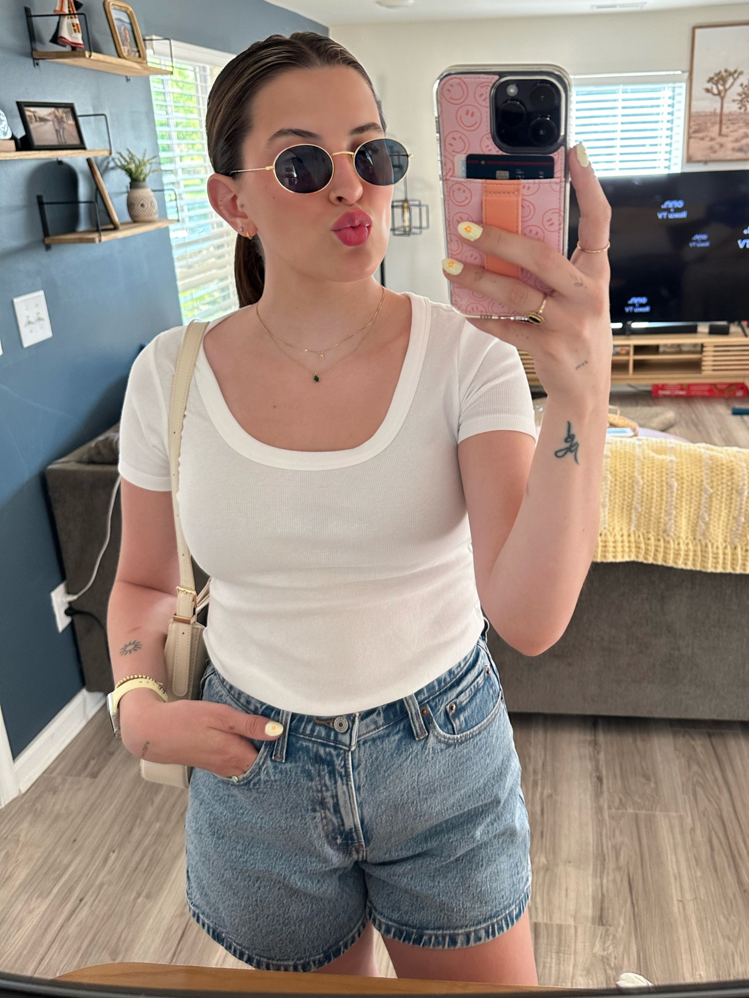 90s vibe summer outfit. Neutral and basics. Gold rimmed oval sunglasses, white basic tee, dad shorts. Vintage looking shorts 

#LTKfit #LTKFind #LTKSeasonal