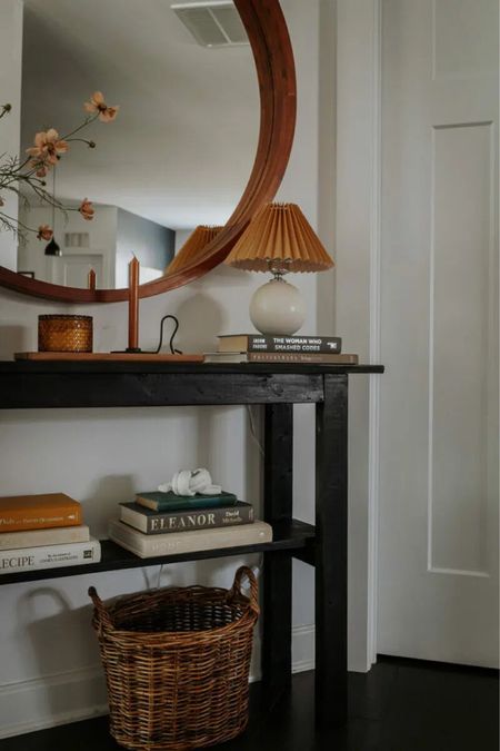 Entryway styling, books, clay knot, basket, lamp with pleated shade, candles 

#LTKSeasonal #LTKunder100 #LTKhome