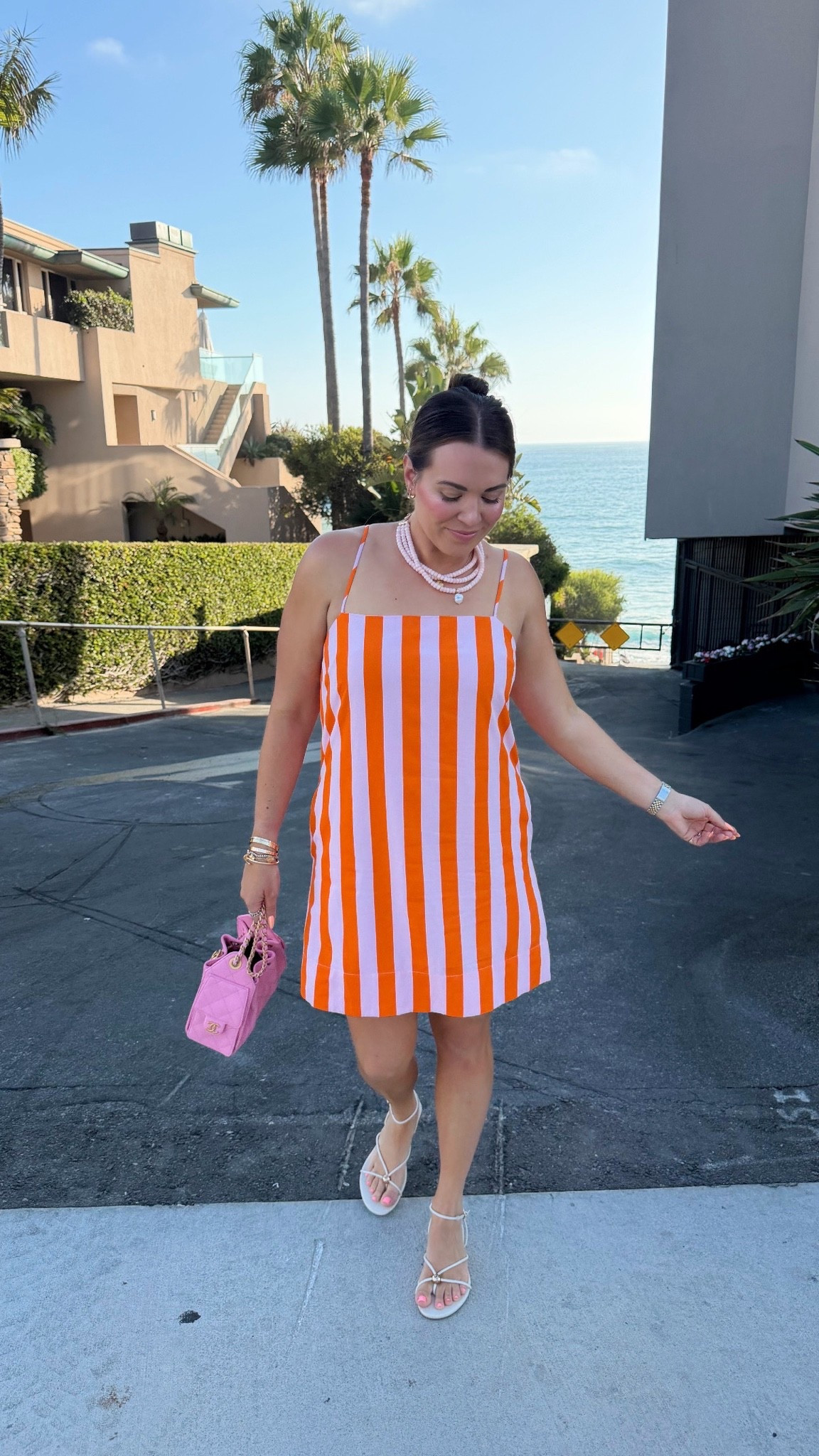 curvy midsize summer beach vacation look! wearing size large in pink and orange striped dress. on major under $50.

#LTKMidsize #LTKTravel #LTKSaleAlert