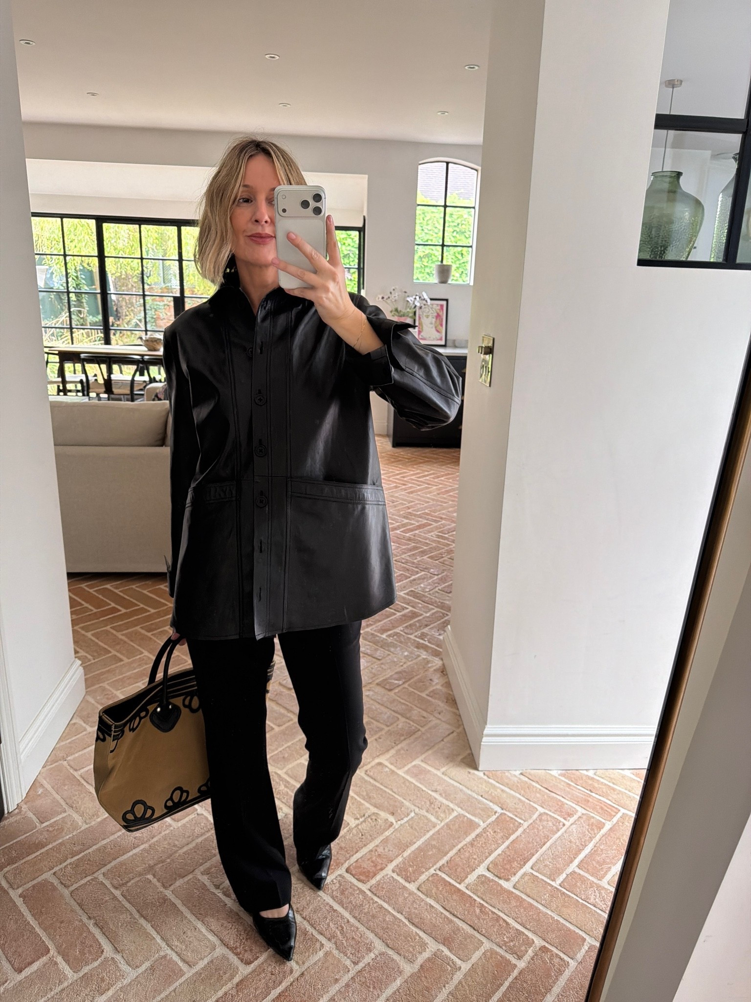 black leather shirt jacket, black leather shacket, black tailored trousers, black pointed pumps, black slingback heels, embroidered floral tote, structured handbag, monochrome outfit, tonal black outfit, elevated basics, quiet luxury, effortless chic, transitional dressing, ltkstyletip, ltkseasonal, ltkfindsunder100, outfit inspo, capsule wardrobe essentials

#LTKFashionMonth #LTKautumn #LTKdatenight