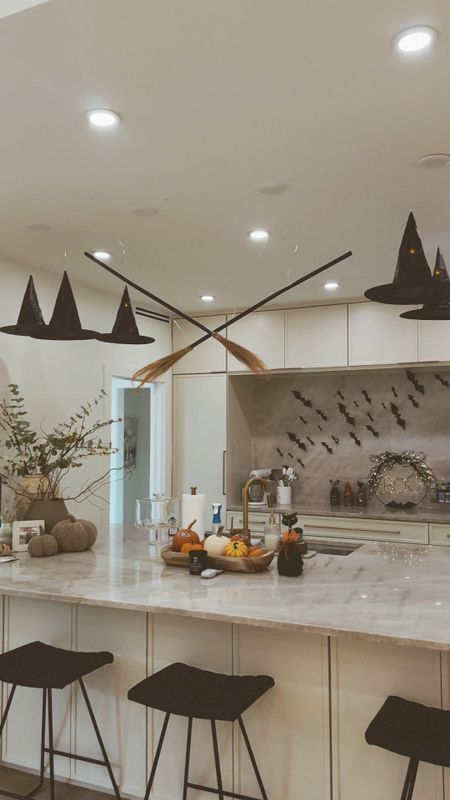 easy spooky Halloween decor that your kids will love!! 

witch hats, witch brooms, halloween, halloween home decor 