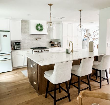 White and wood kitchen cabinets and soft fabric stools make this kitchen perfect for family living. 

#LTKfindsunder100 #LTKhome #LTKfamily