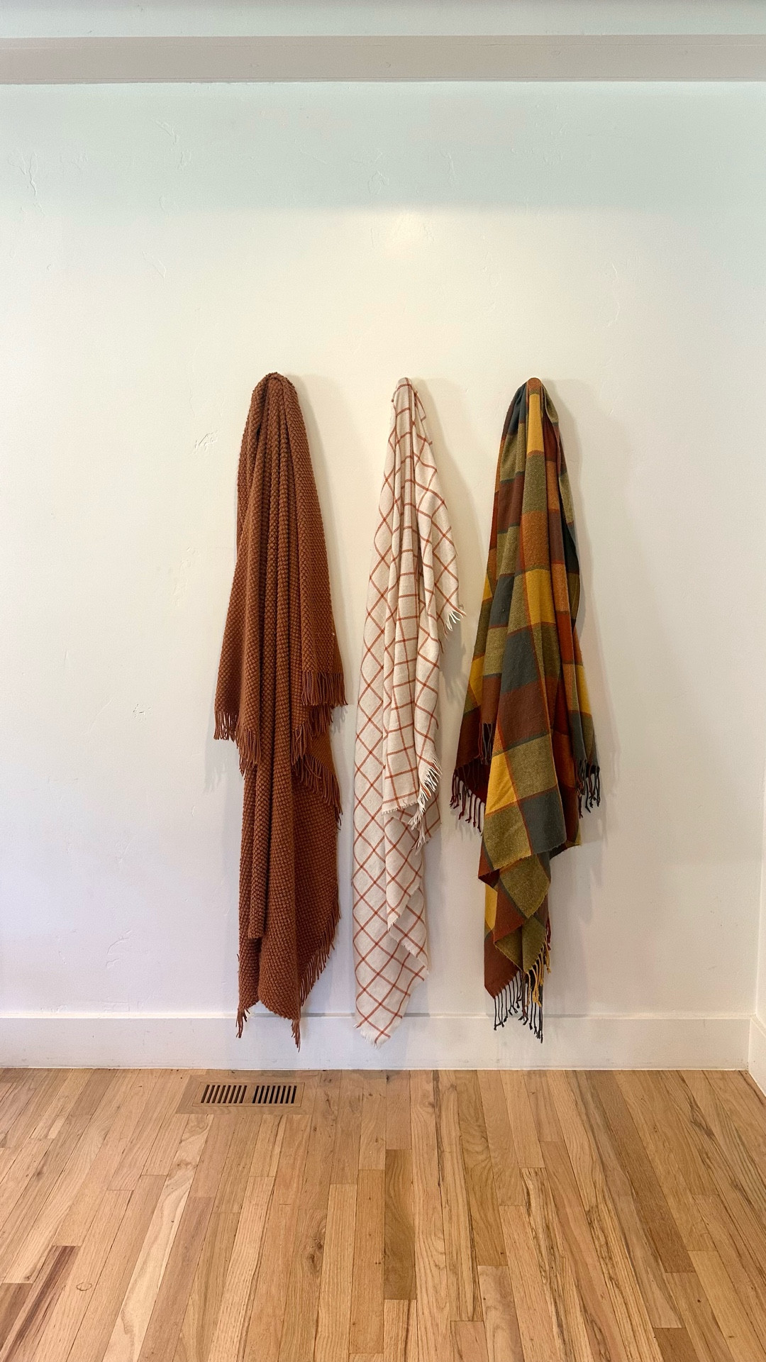 Blank wall tip, add wooden hooks and hang your favorite blankets! You can switch out seasonally! 

#LTKFindsUnder50 #LTKHome #LTKSeasonal