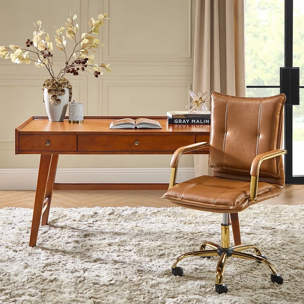 This mid century modern office set from Wayfair is such a stunning workspace upgrade for creating a warm and elevated home office. The rich wood desk paired with the camel faux leather office chair gives it that timeless executive-style look while still feeling modern and functional. Love the built-in outlets and drawer storage for keeping a workspace organized and practical for everyday use. Perfect for home offices, creative studios, and stylish remote work setups.

#LTKHome