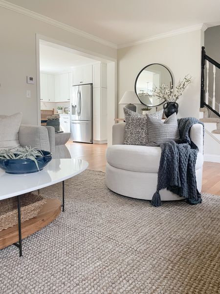 Modern coastal living room, swivel chair, throw pillows, home decor, jute rug, coffee table 

#LTKstyletip #LTKhome