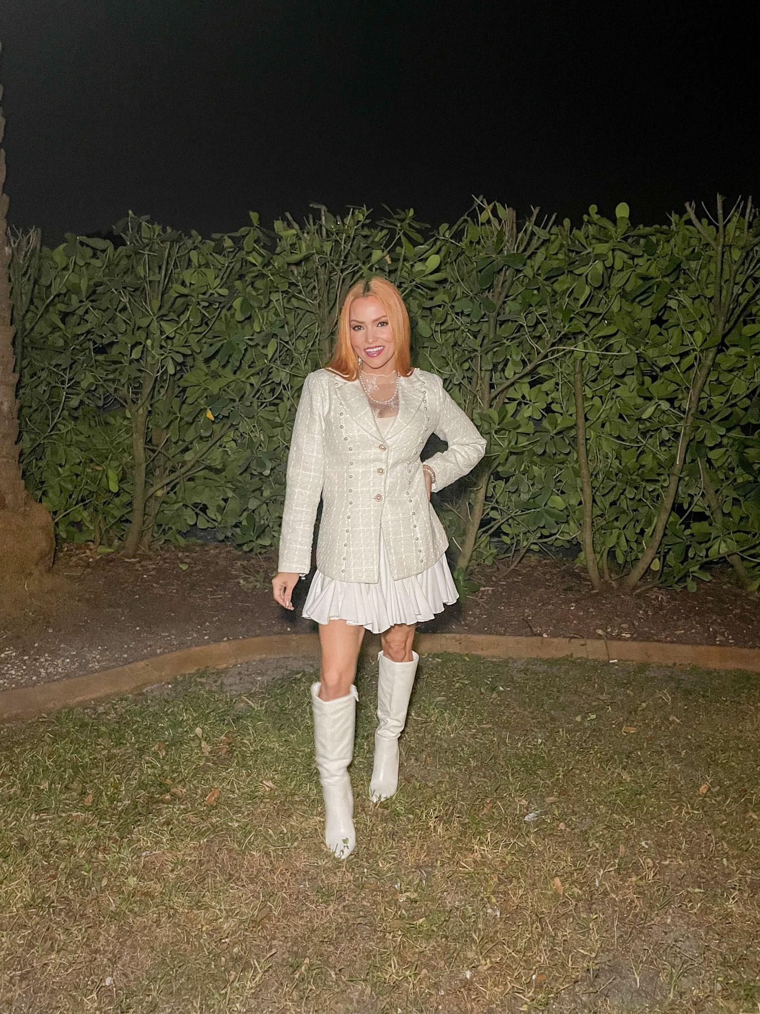 short skirt, lace undershirt, a tweed blazer, matched perfectly with a pair of calf boots.