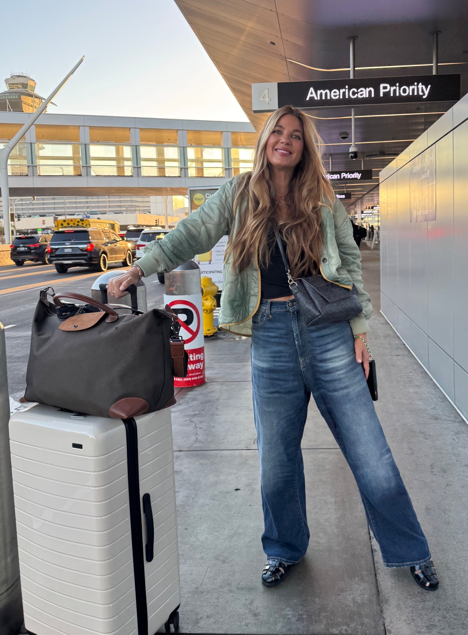Travel ready and headed to the LTKCon. ✈️ 
Tank: 💯 cotton with a shelf bra so you can skip the bra! I buy this tank in multiples (size medium) 
Jeans: 26 and delightfully oversized 
Shoes: TTS
Jacket: sold out but will link similar
This suitcase holds EVERYTHING and then some and my carryon bag is equally capacious  

#LTKBeauty #LTKStyleTip #LTKTravel